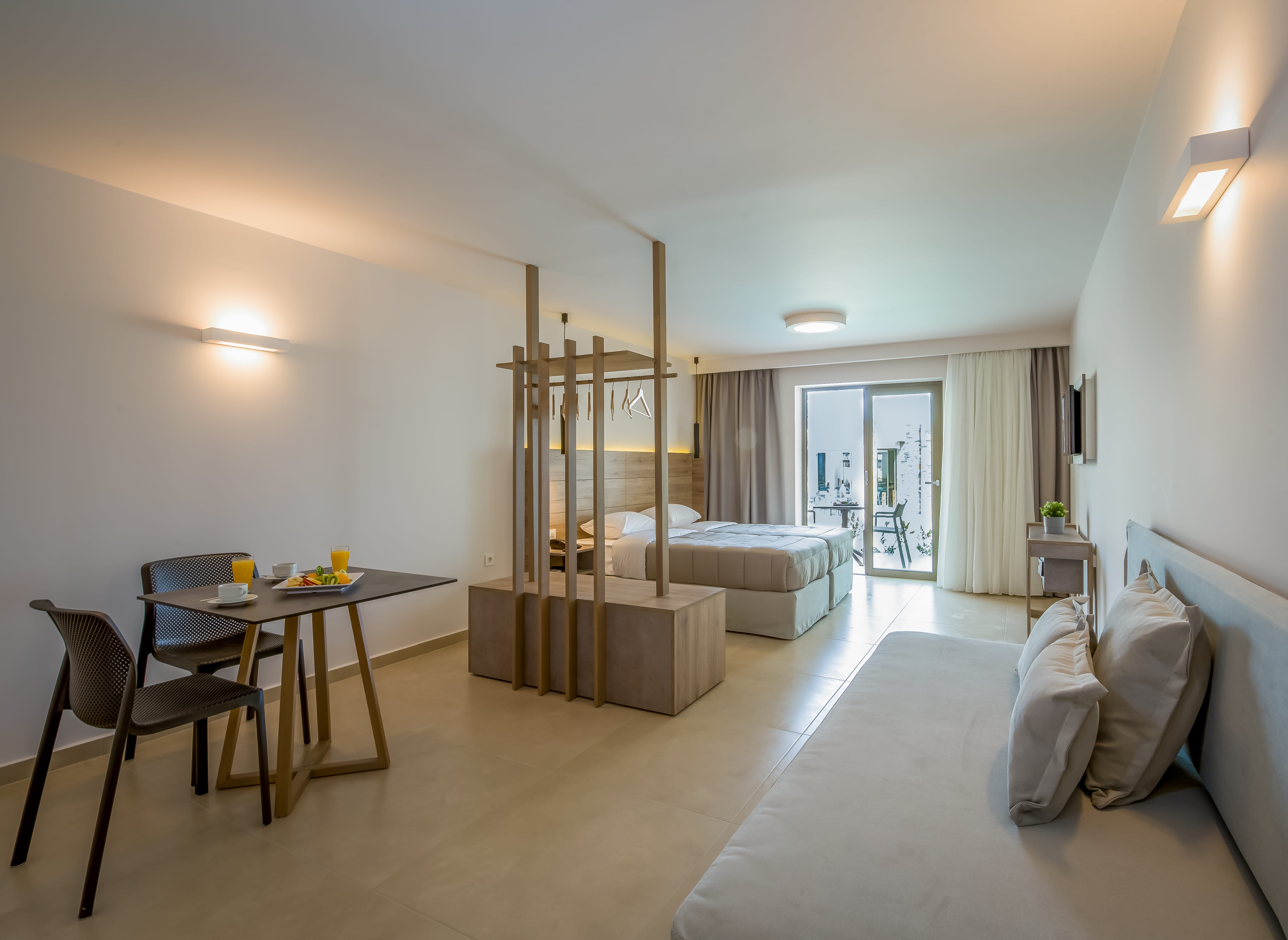 a living room with a bed and a table