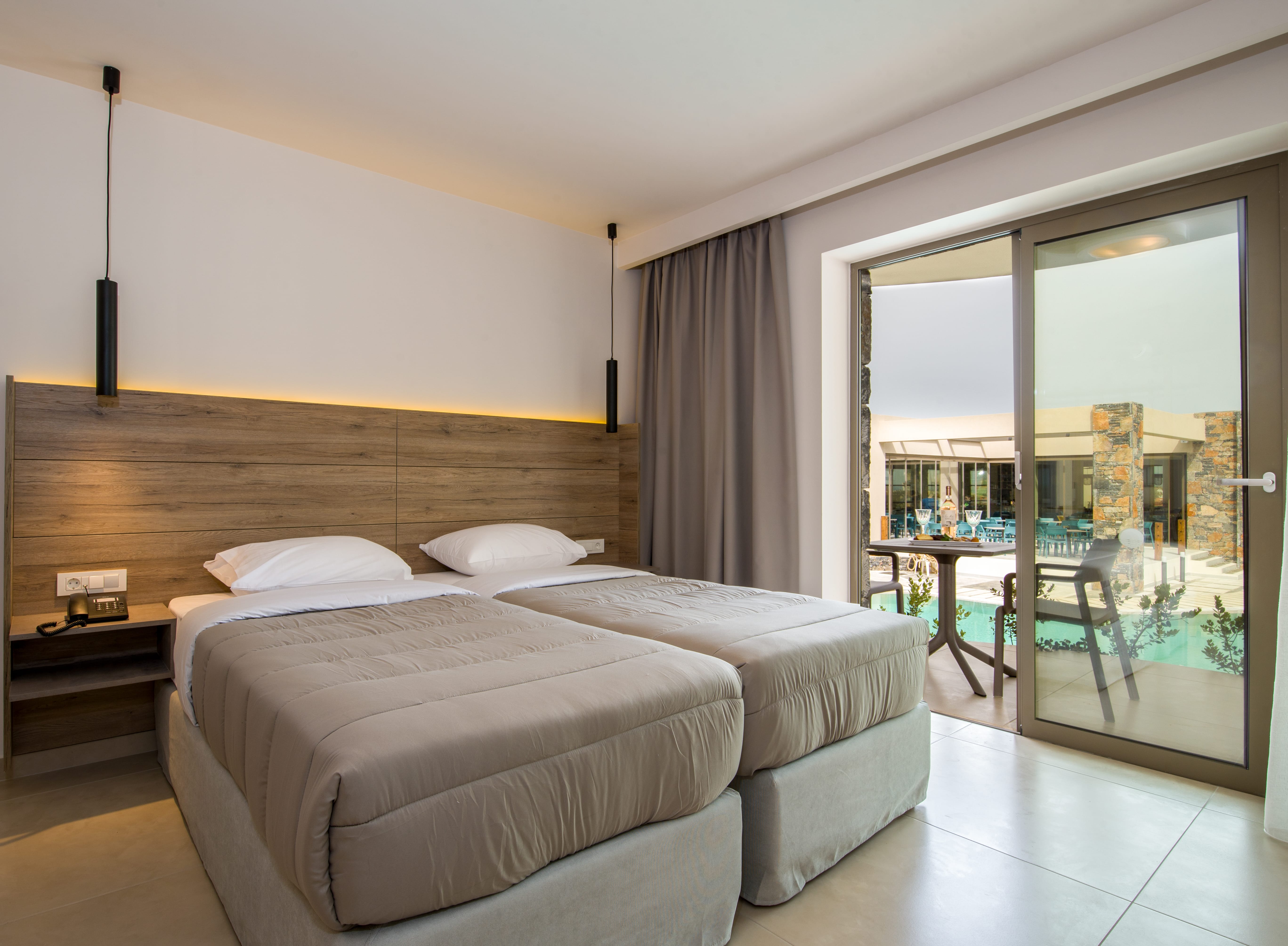 a bedroom with a large glass door