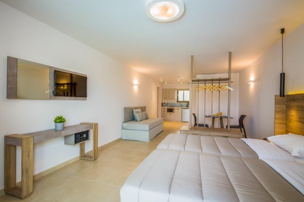 a hotel room with a bed and a desk