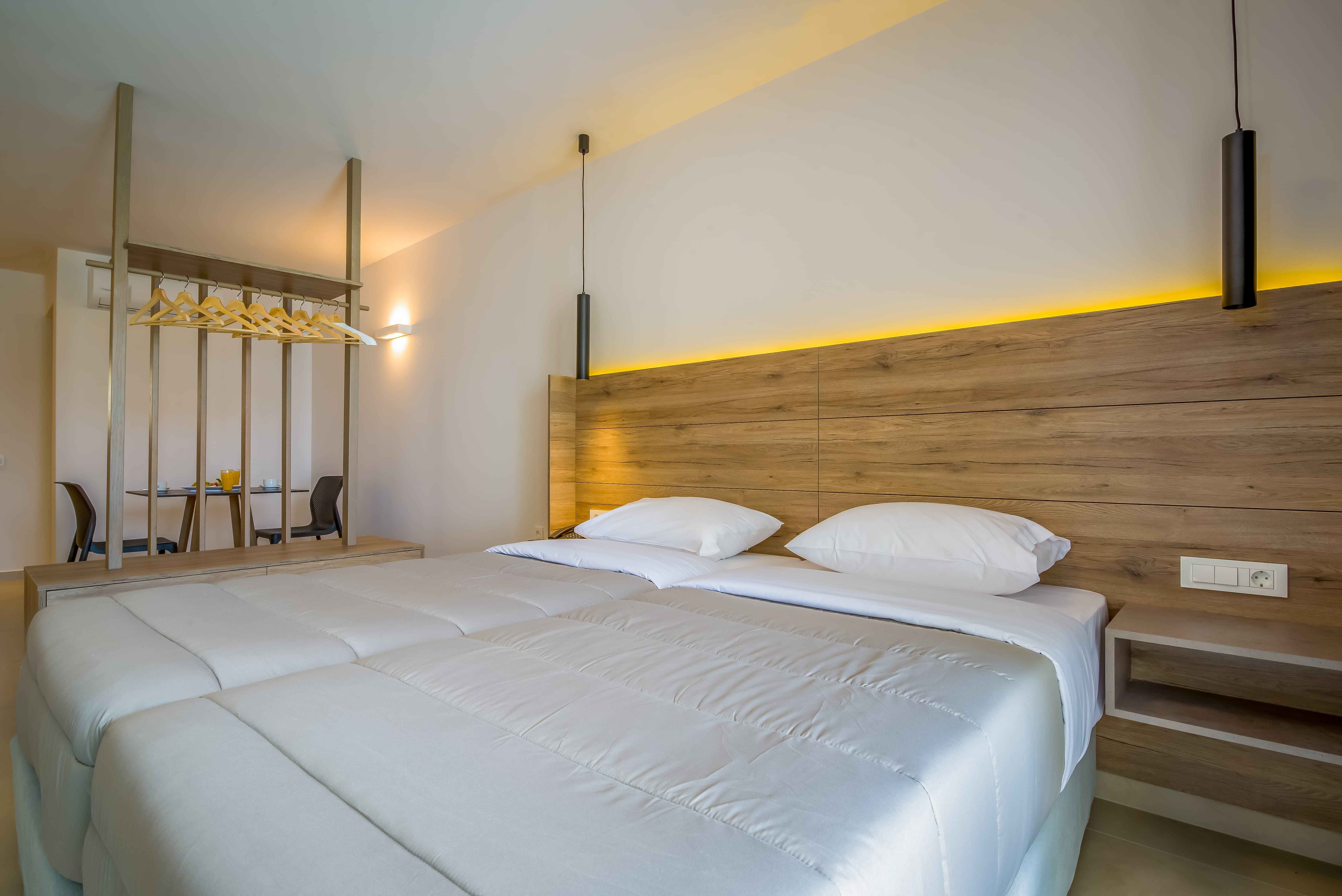 a couple of beds in a room