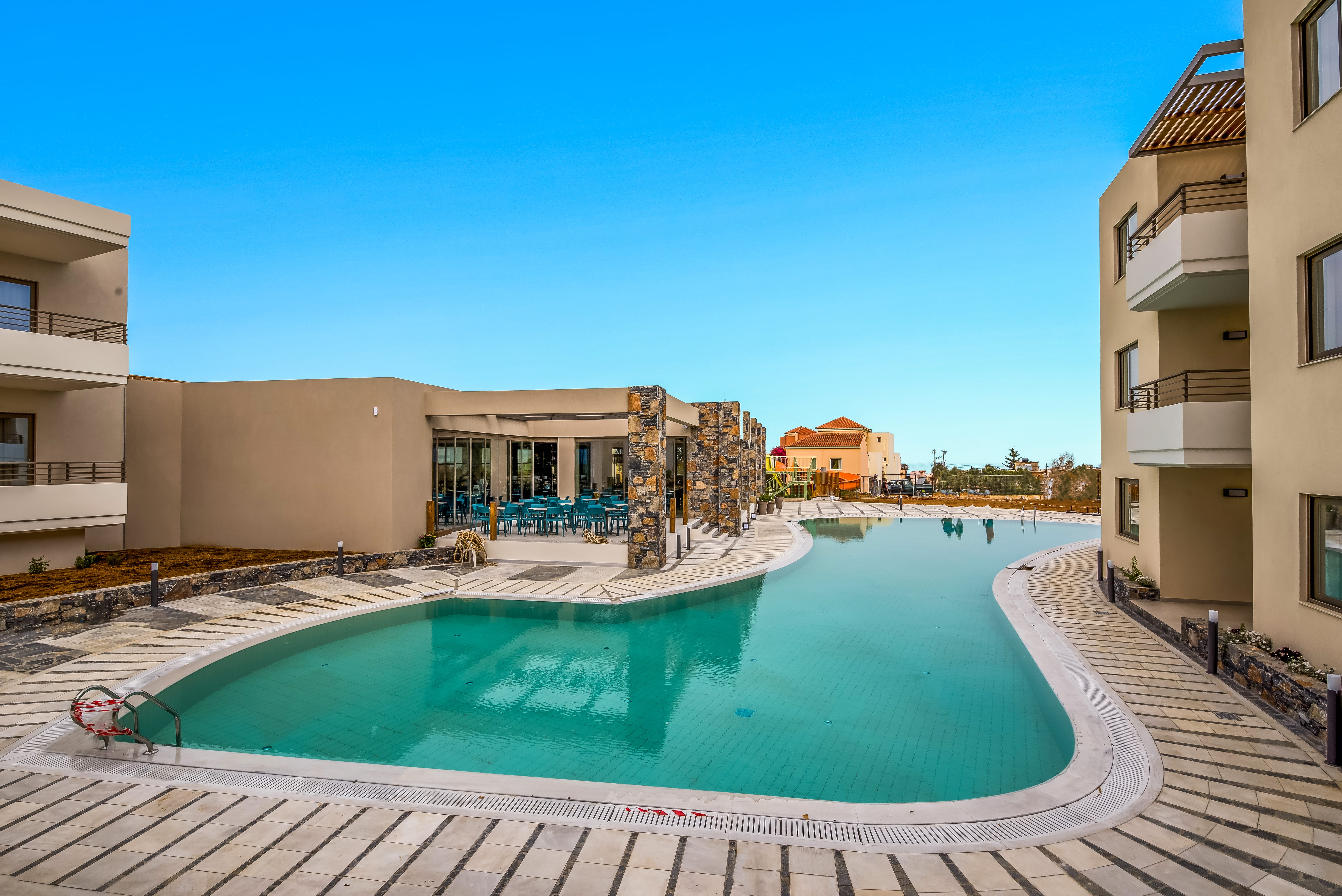 a swimming pool in a courtyard between buildings