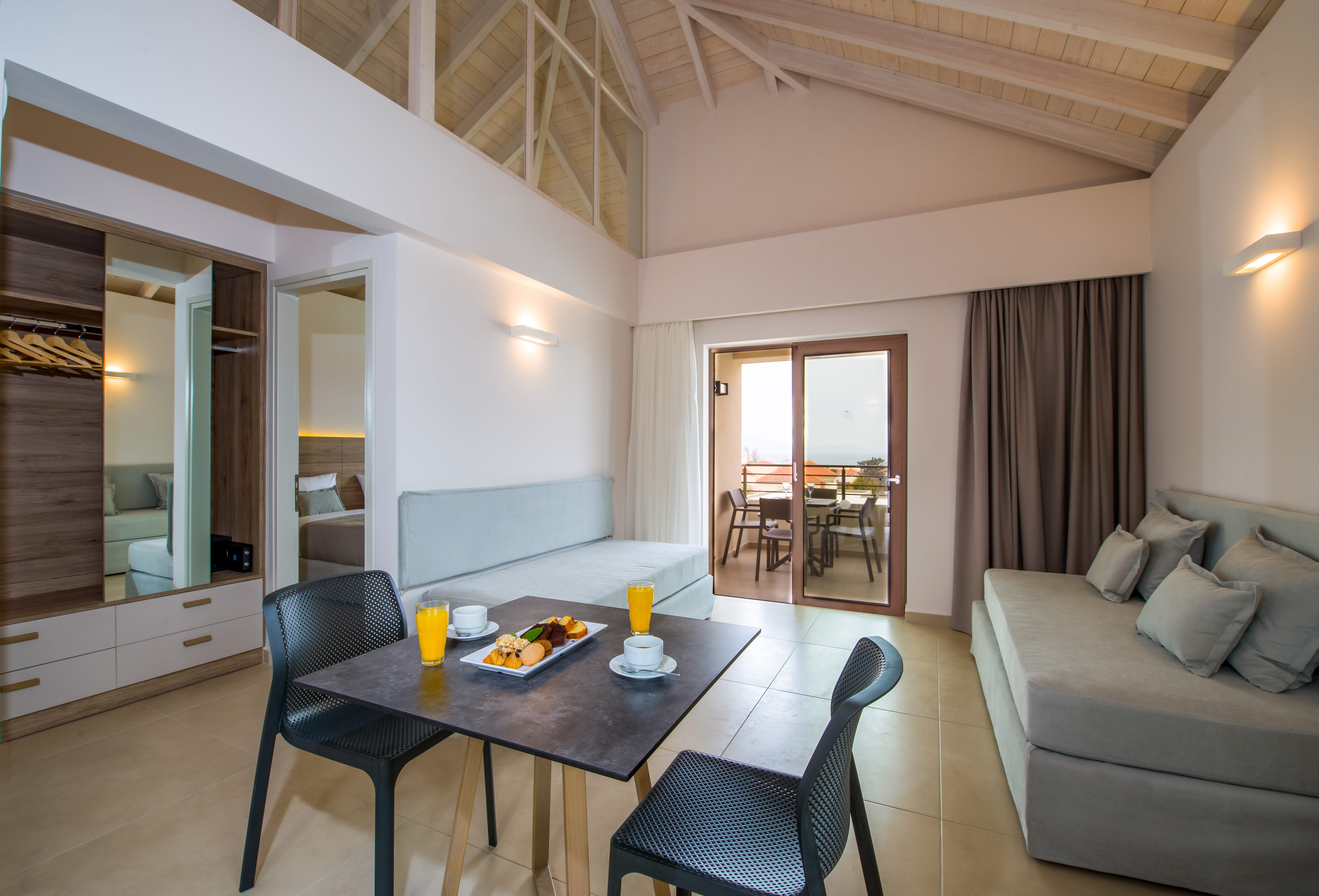 a living room with a table and chairs