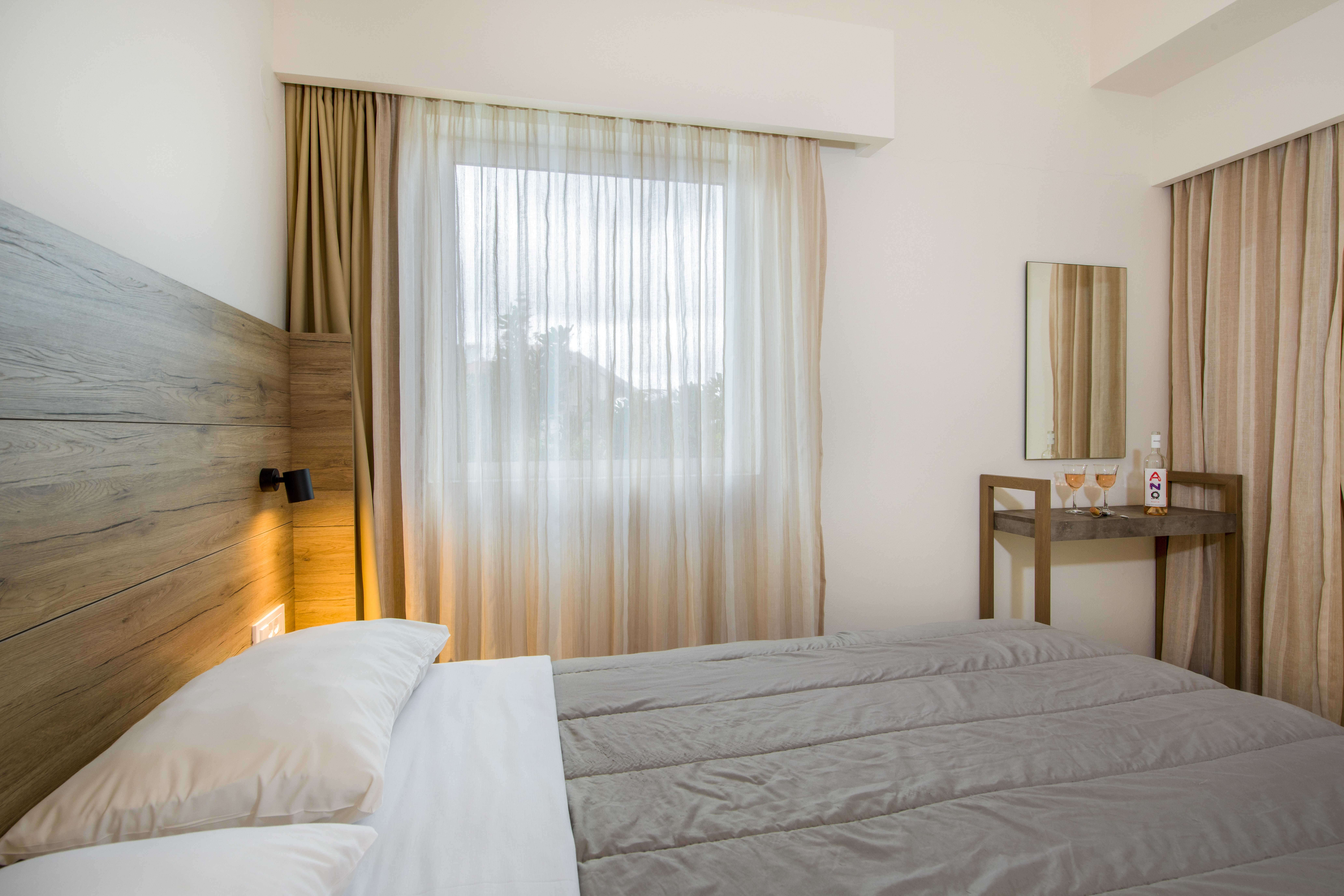 a hotel room with a bed and a table