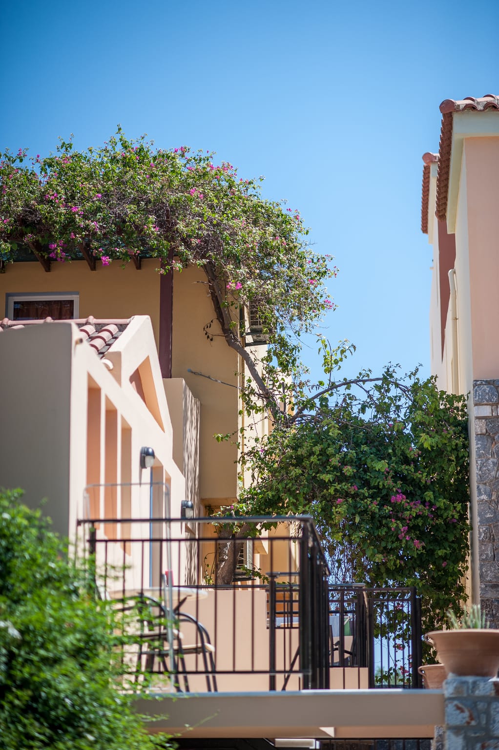 a balcony with a railing and trees