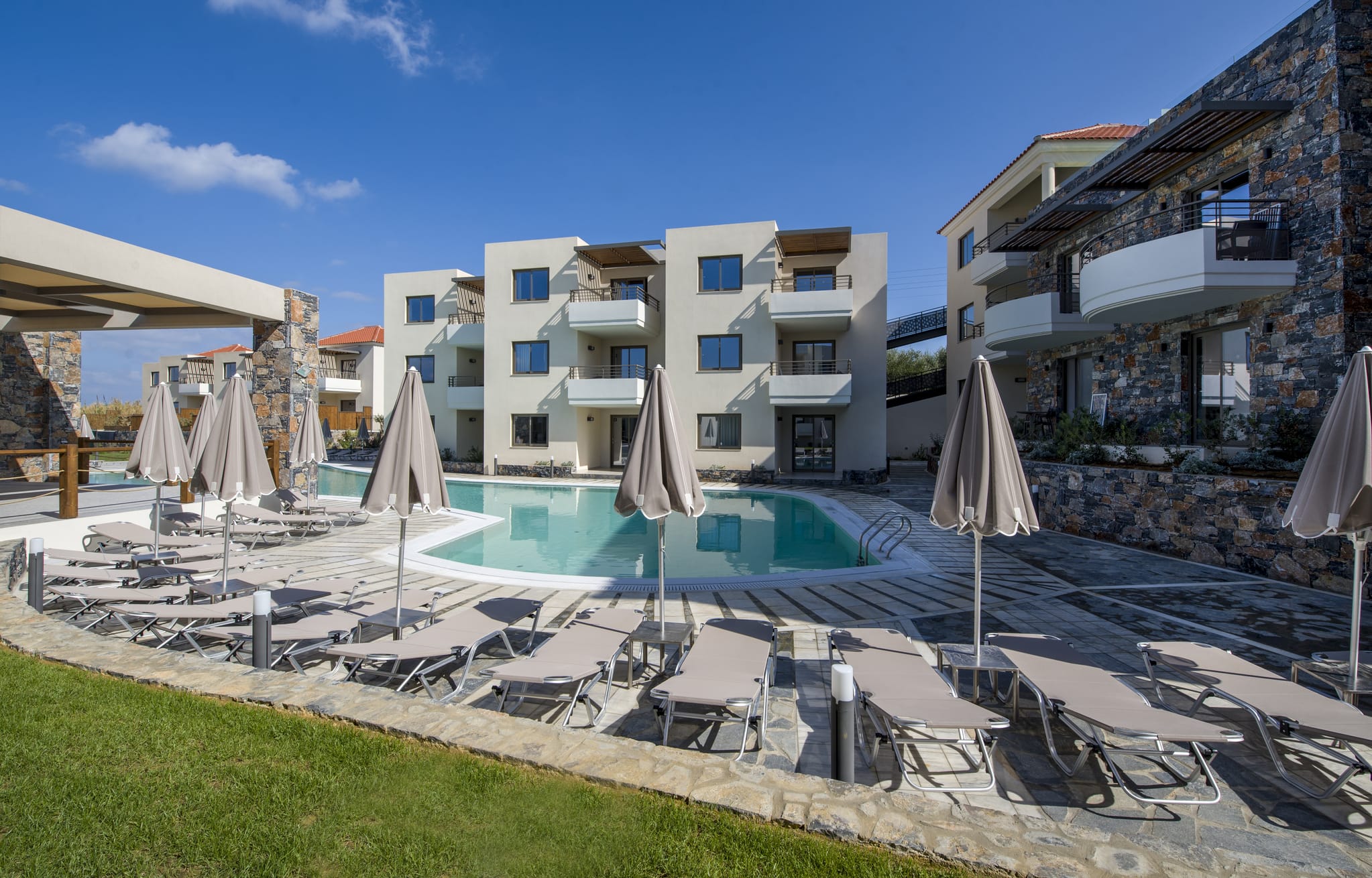 a pool with umbrellas and chairs