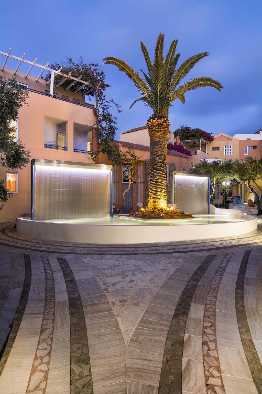 a palm tree in front of a building