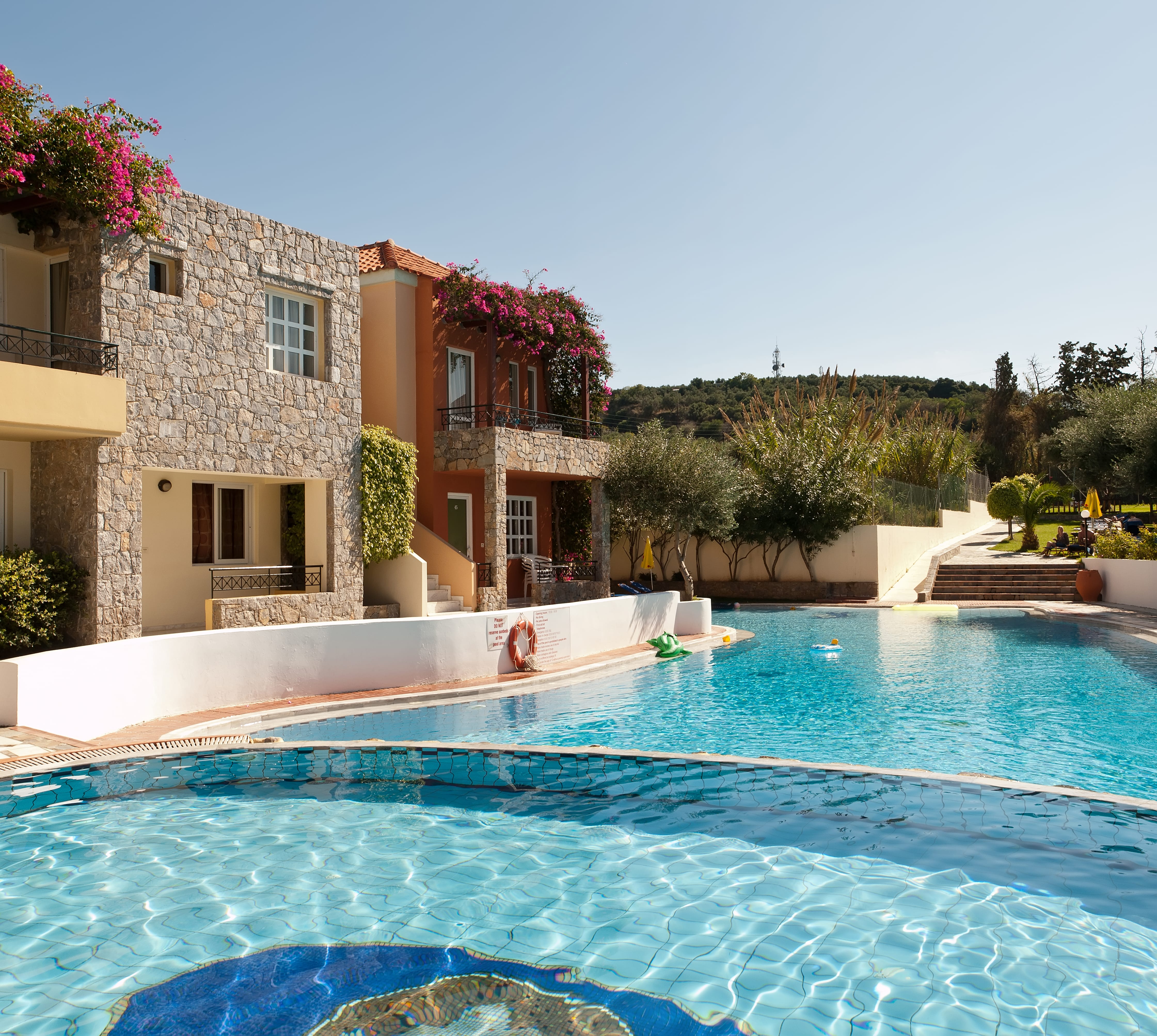 a swimming pool in front of a house