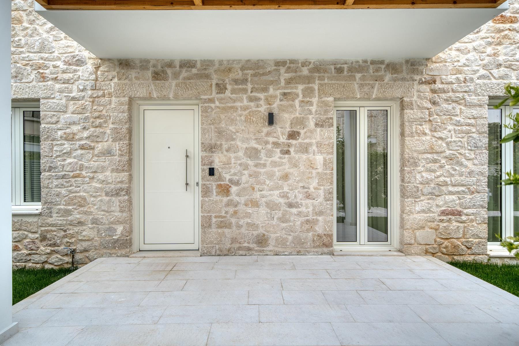 a stone building with a white door