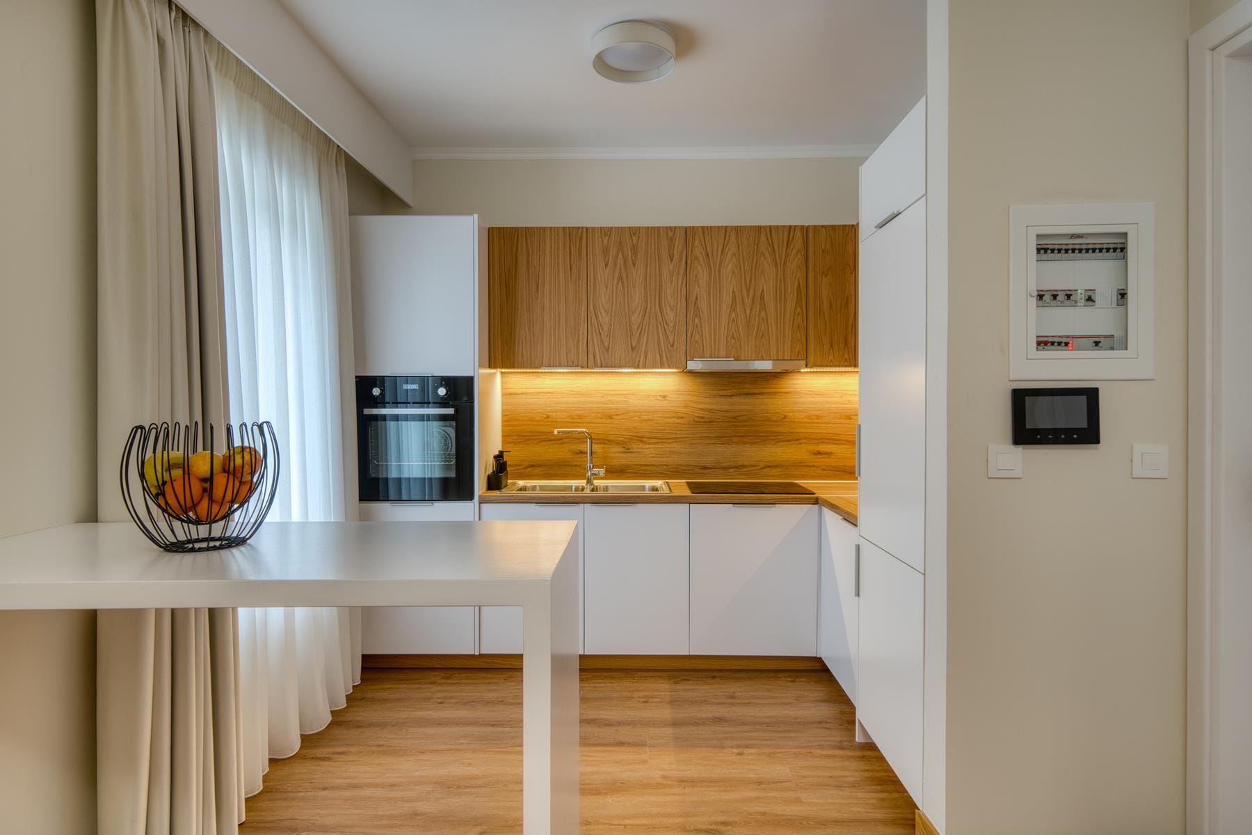 a kitchen with white cabinets