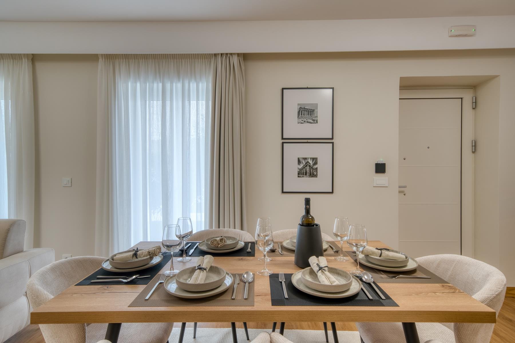 a dining table with plates and glasses