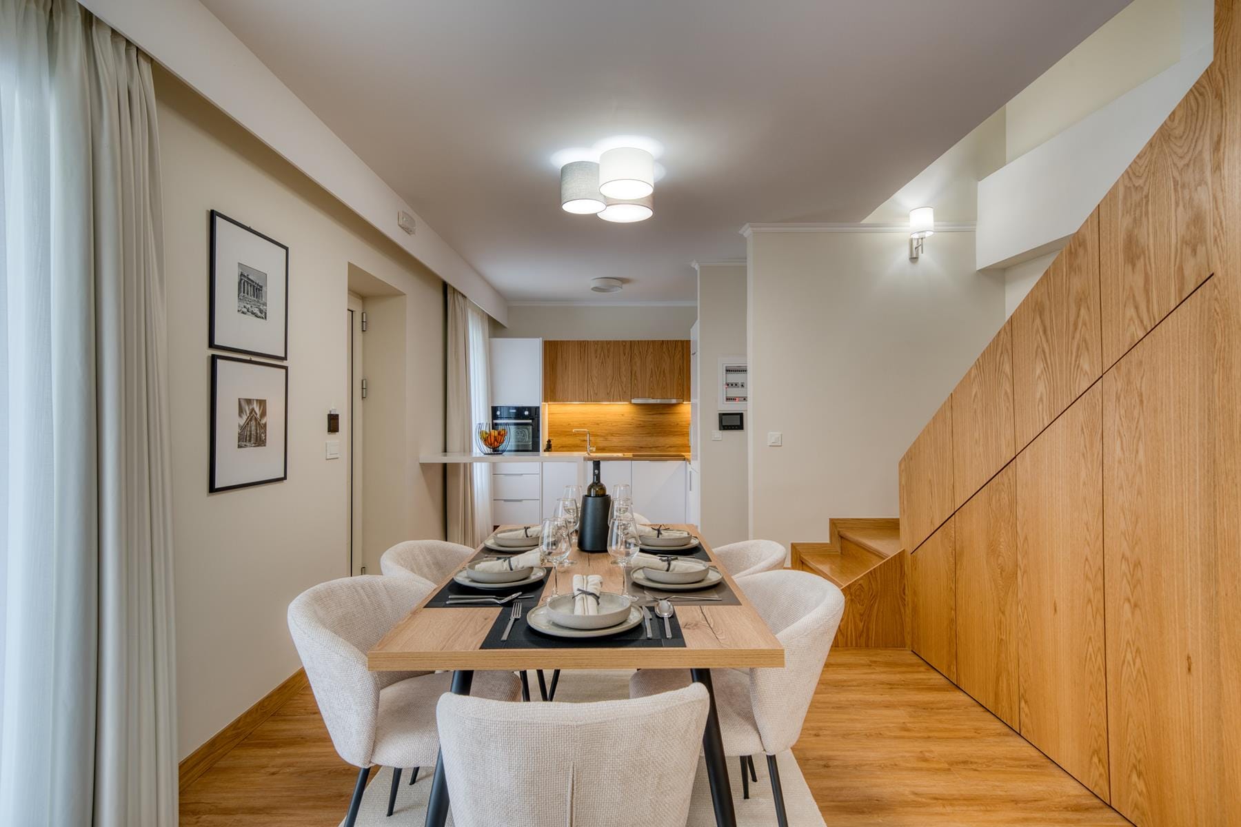 a dining room with a table and chairs