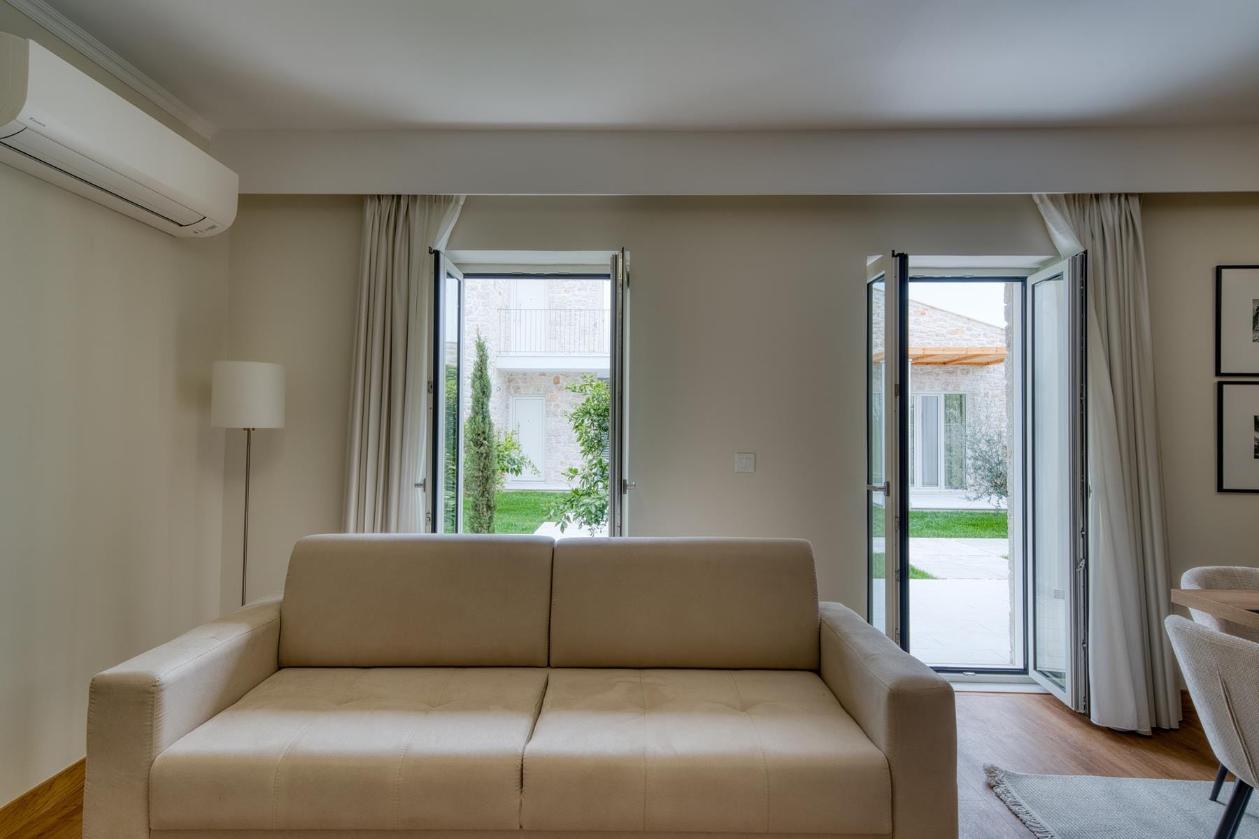 a living room with a couch and a door