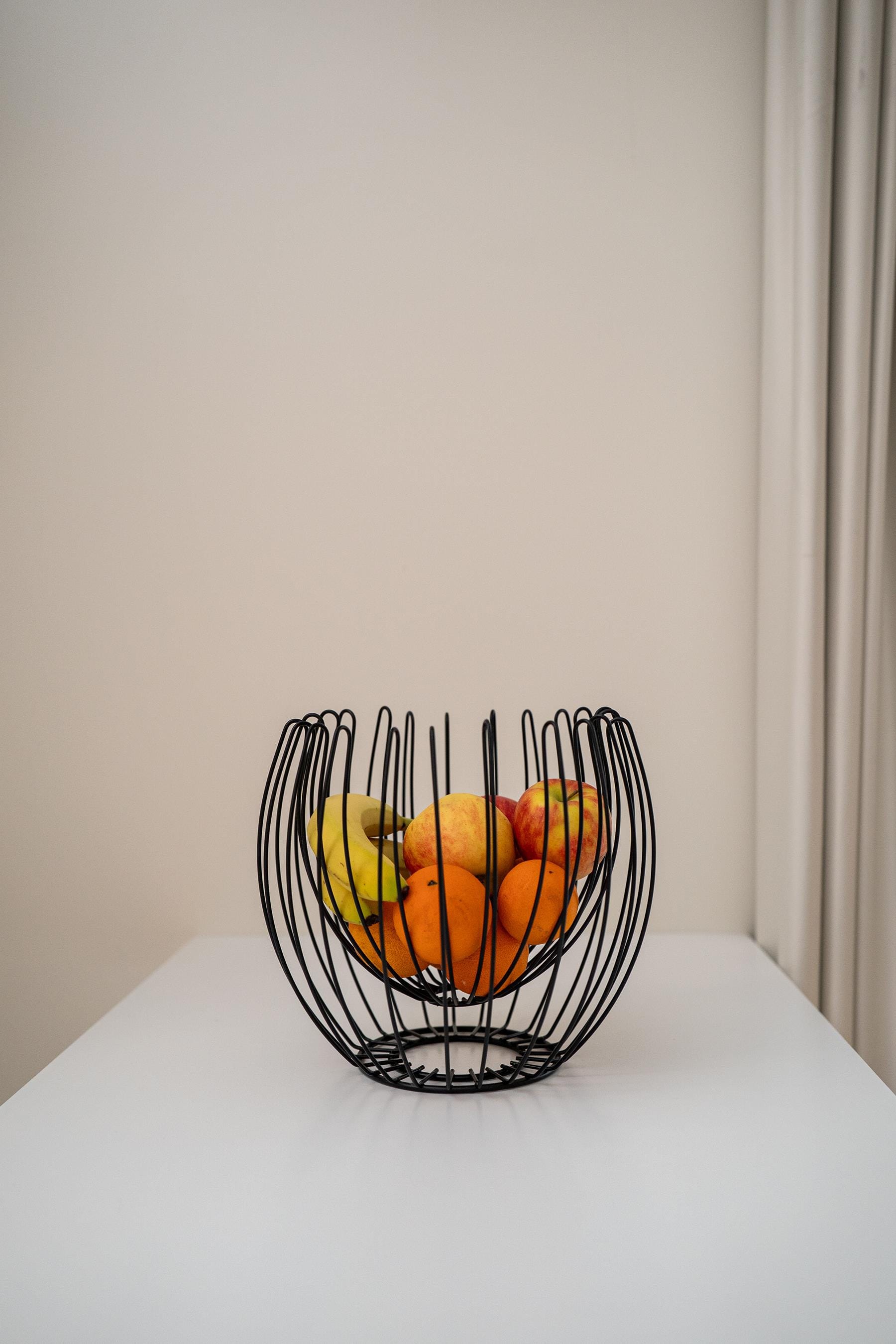 a glass bowl with fruit in it