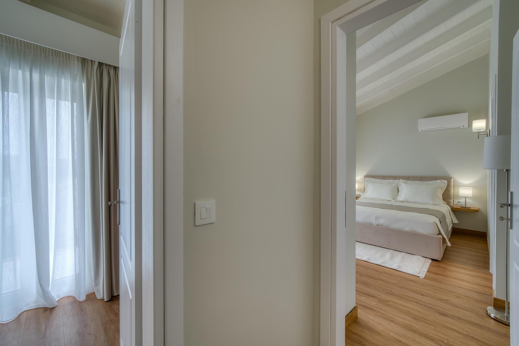 a room with a bed and a mirror