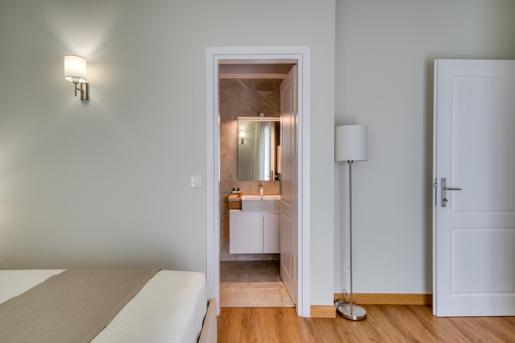 a room with a door and a lamp