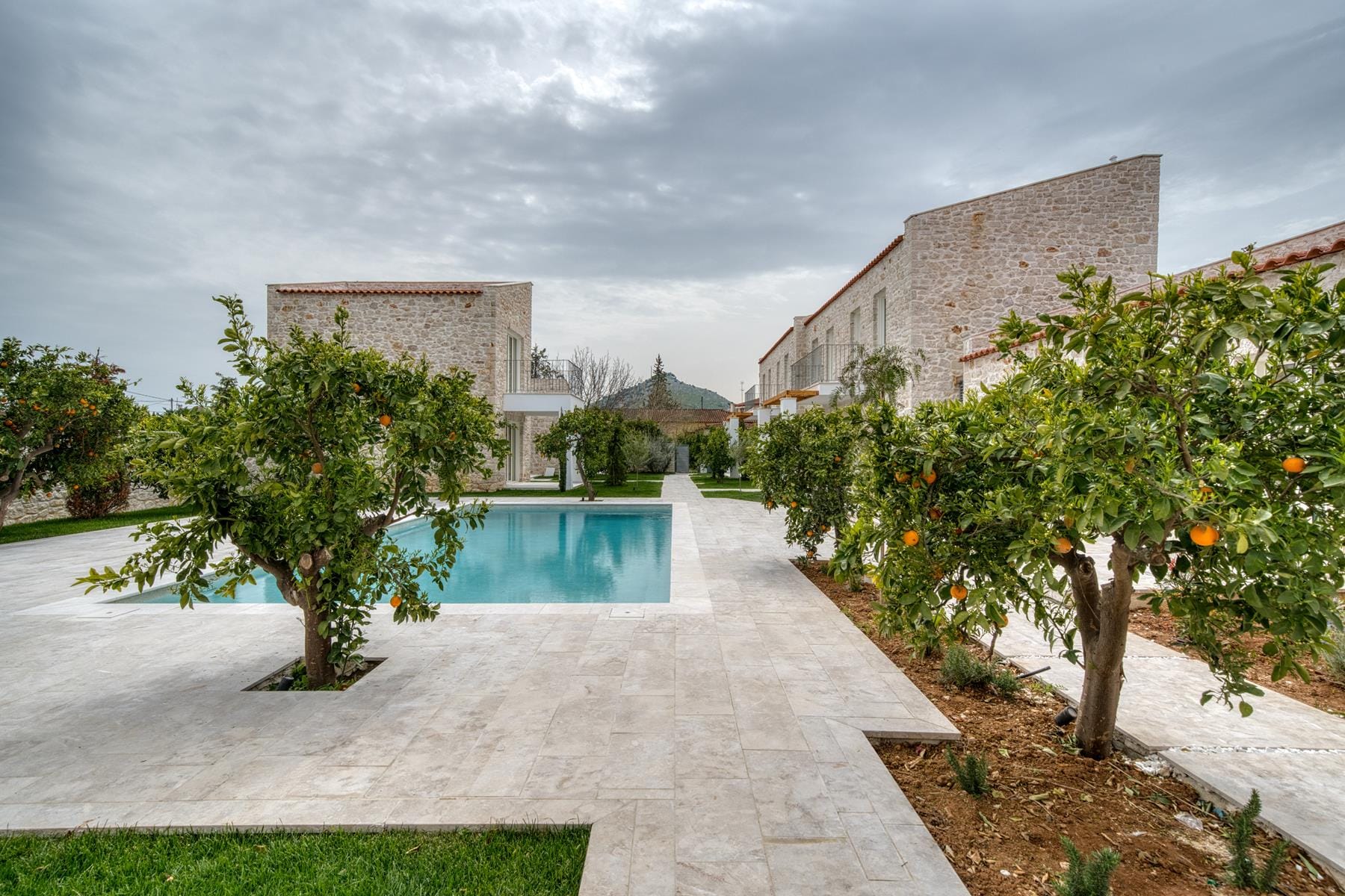 a courtyard with trees and buildings