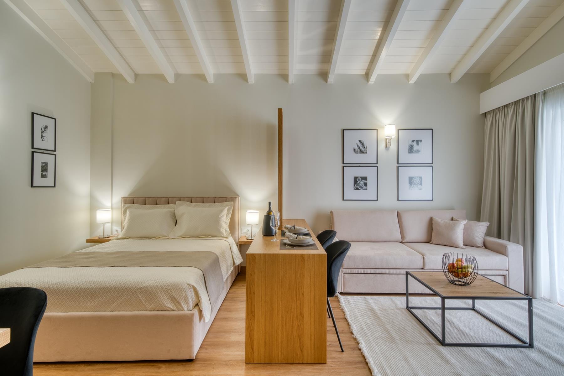 a living room with a bed and couches