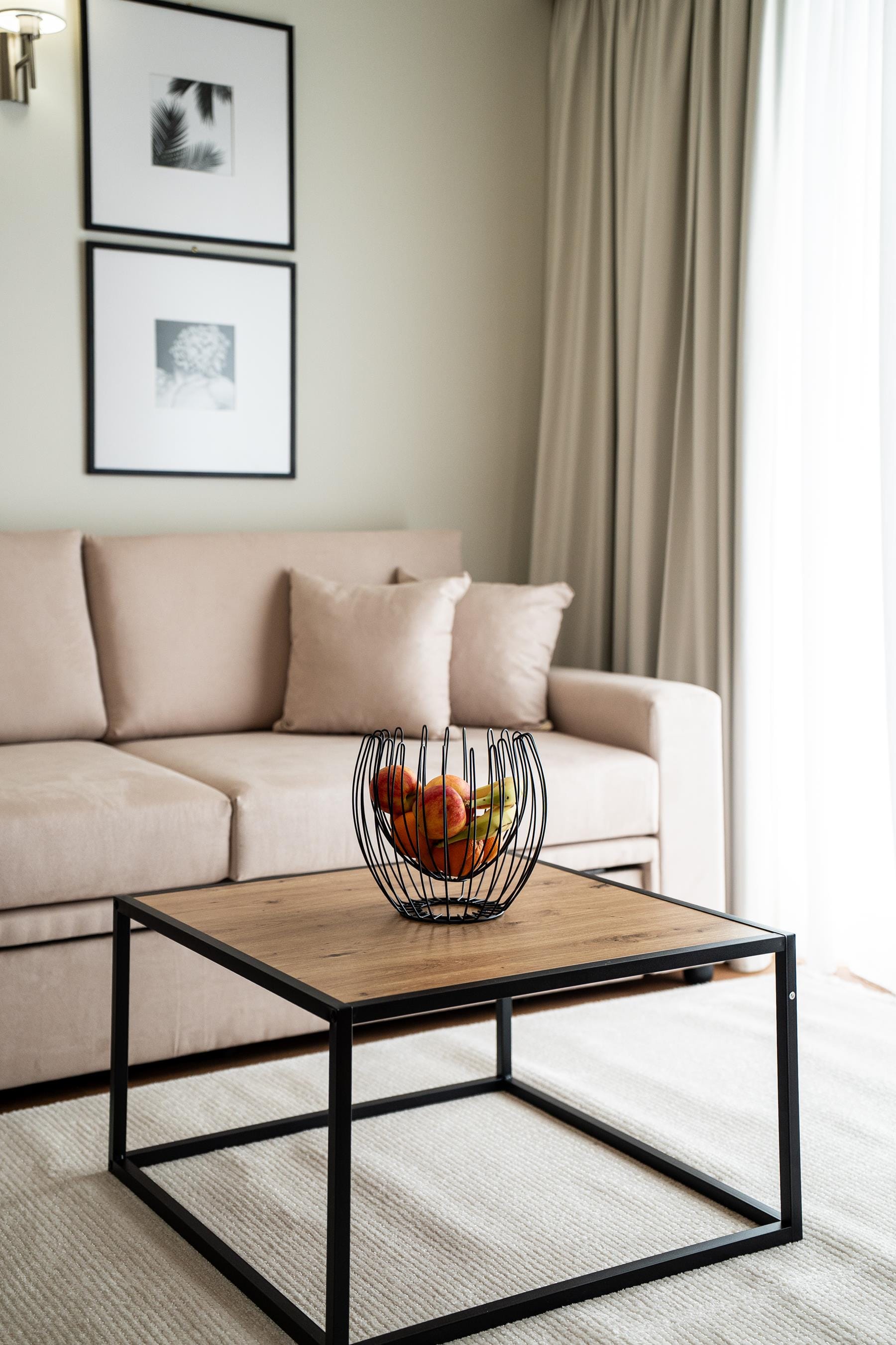 a bowl of fruit on a coffee table