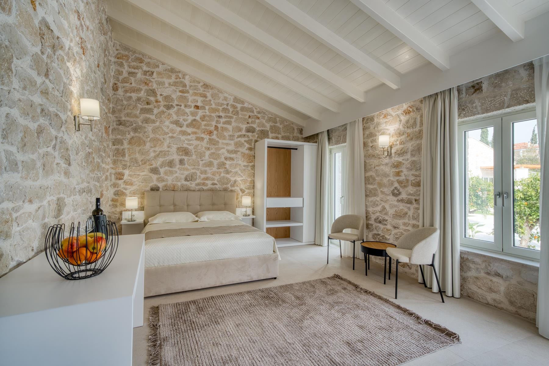 a bedroom with a bed and a table