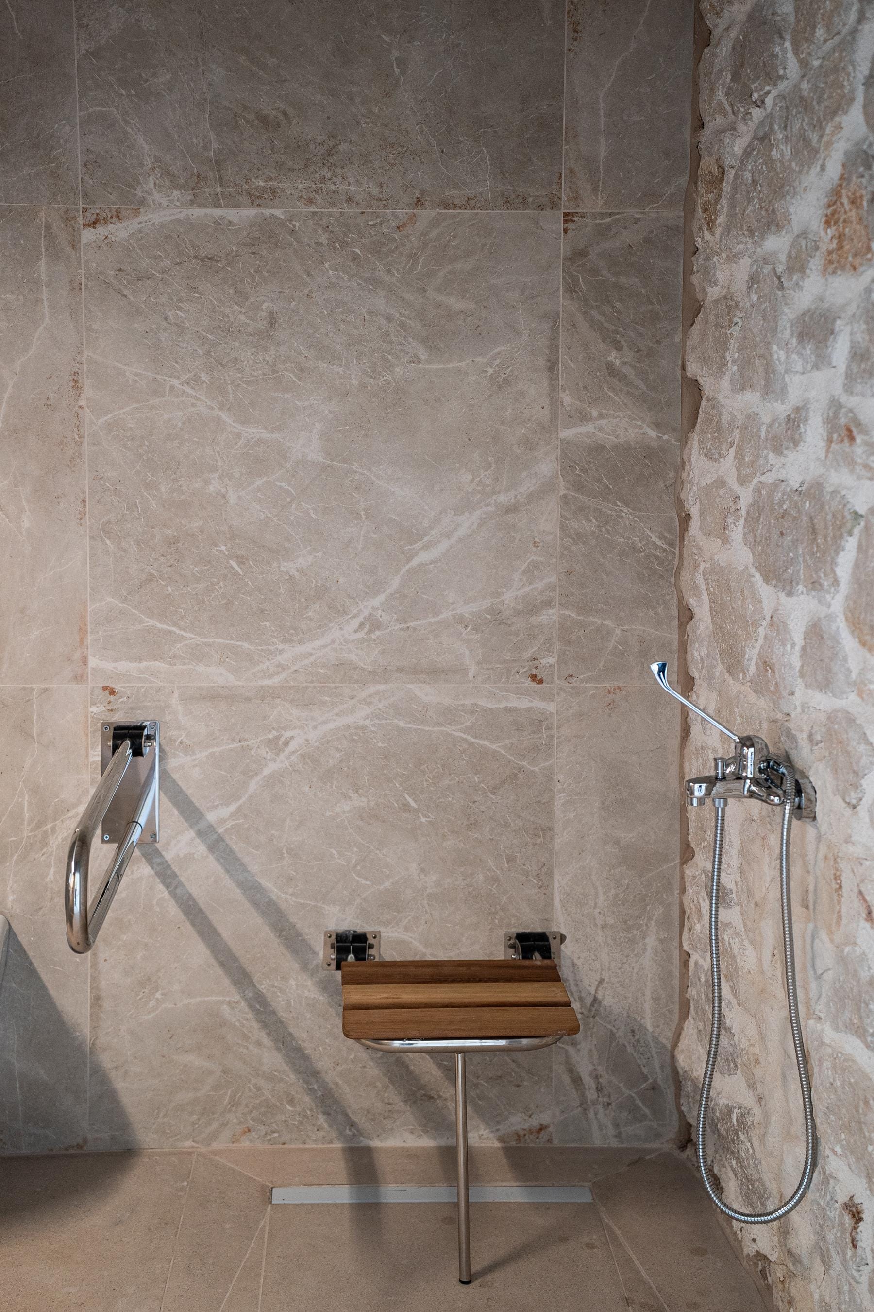 a shower with a stand