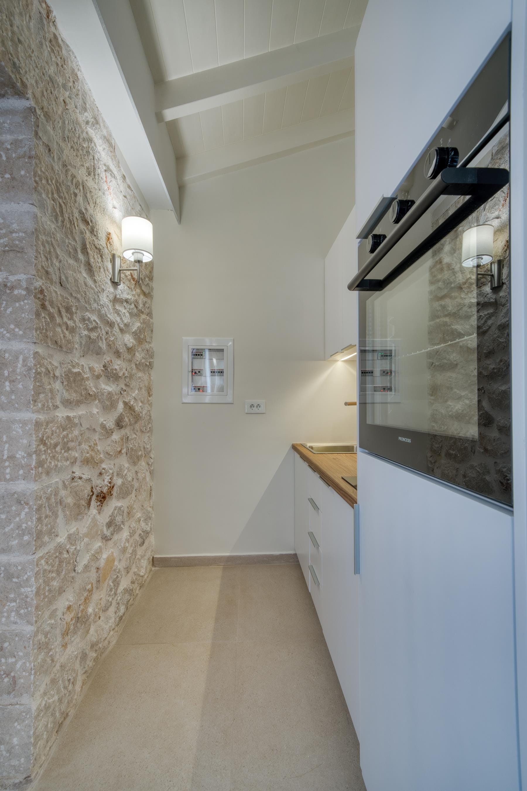 a kitchen with a brick wall