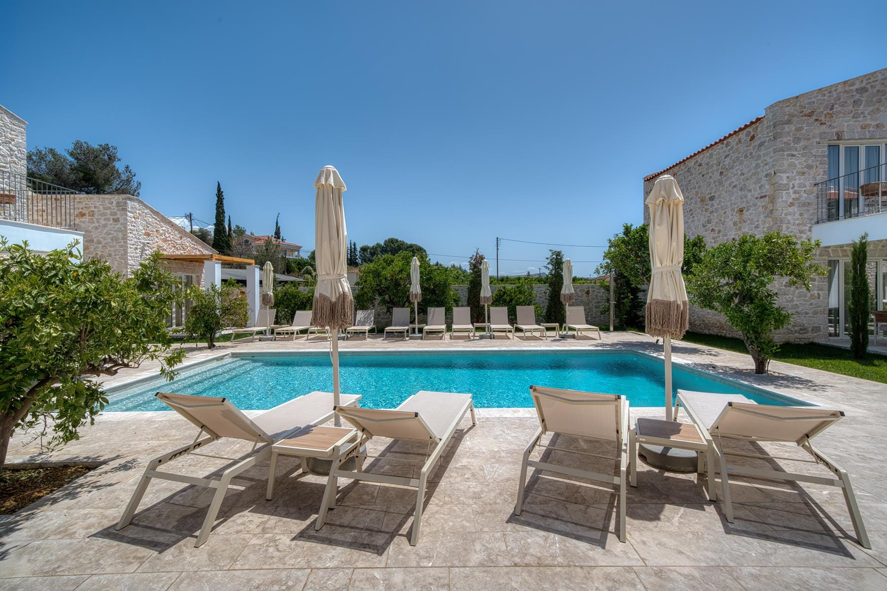 a pool with chairs around it