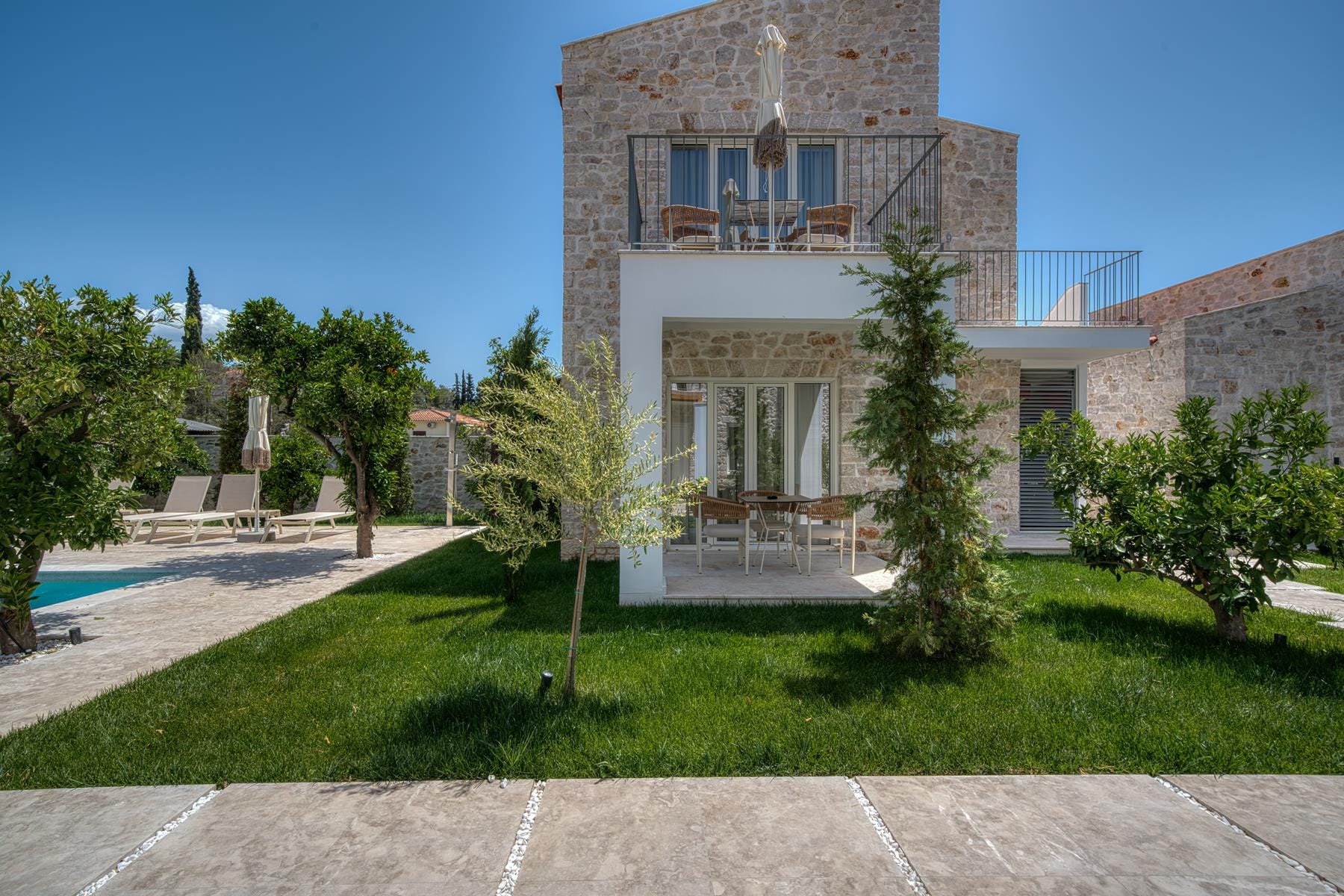 a building with trees and grass