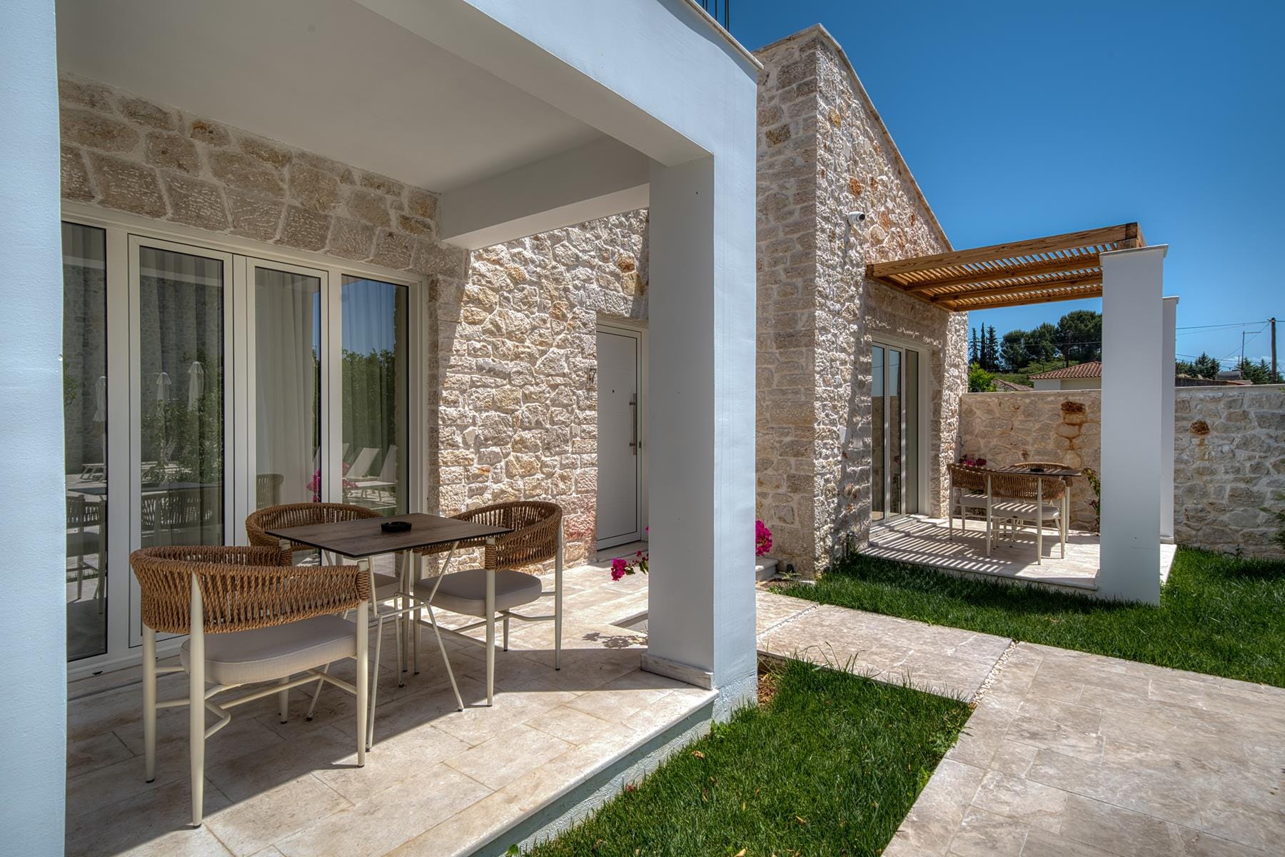 a house with a patio and a table and chairs