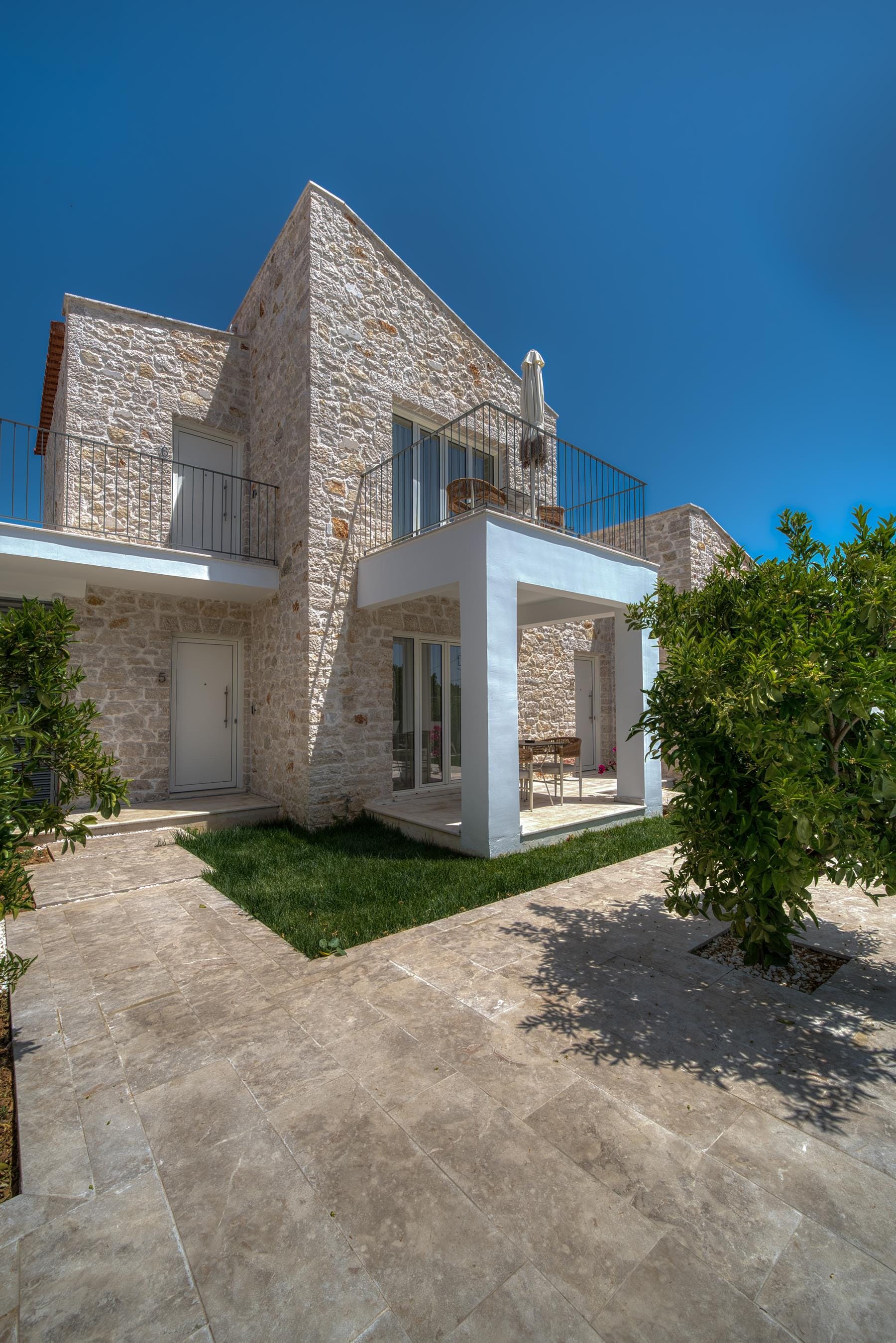 a house with a stone driveway