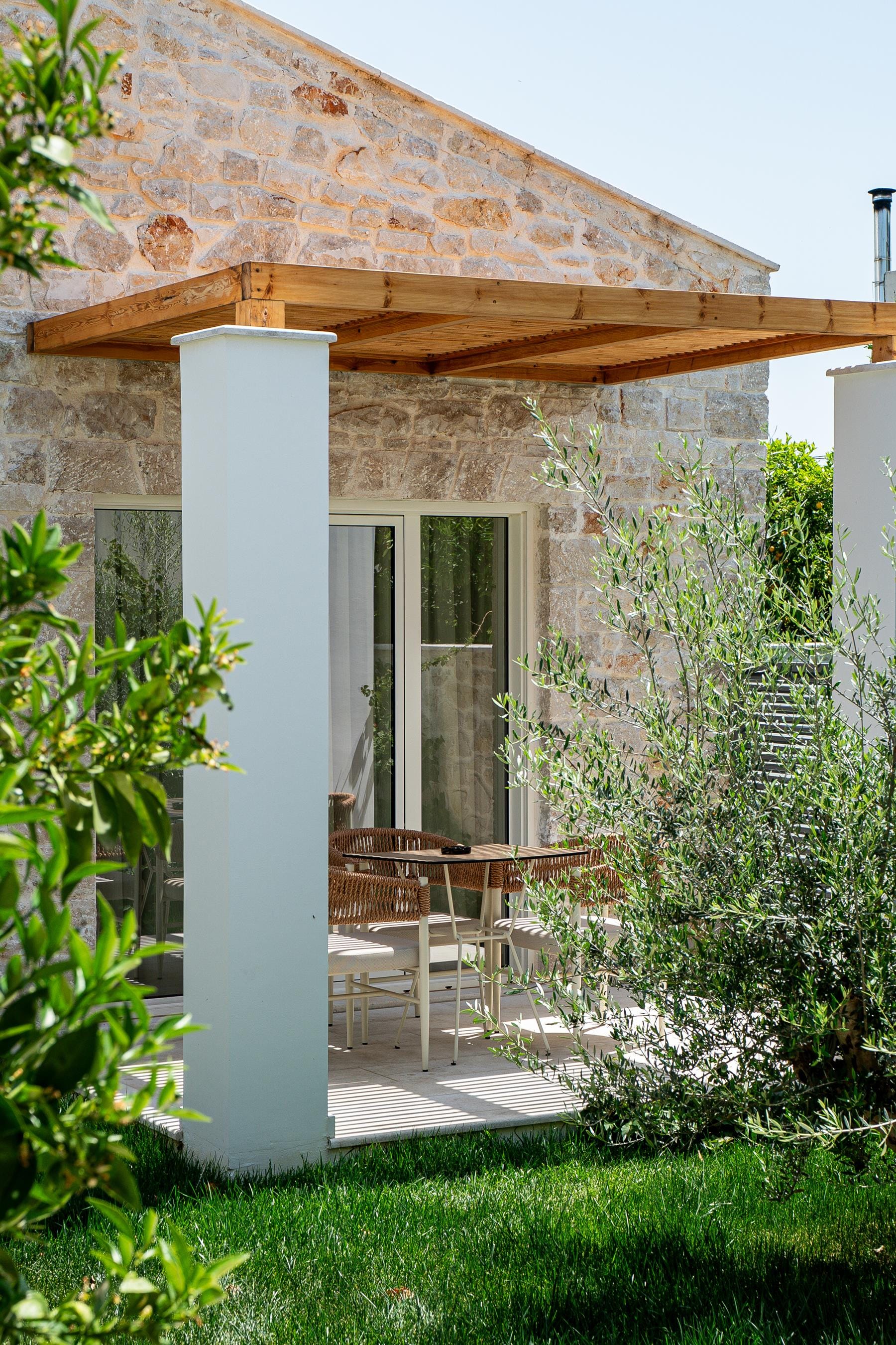 a patio with a table and chairs