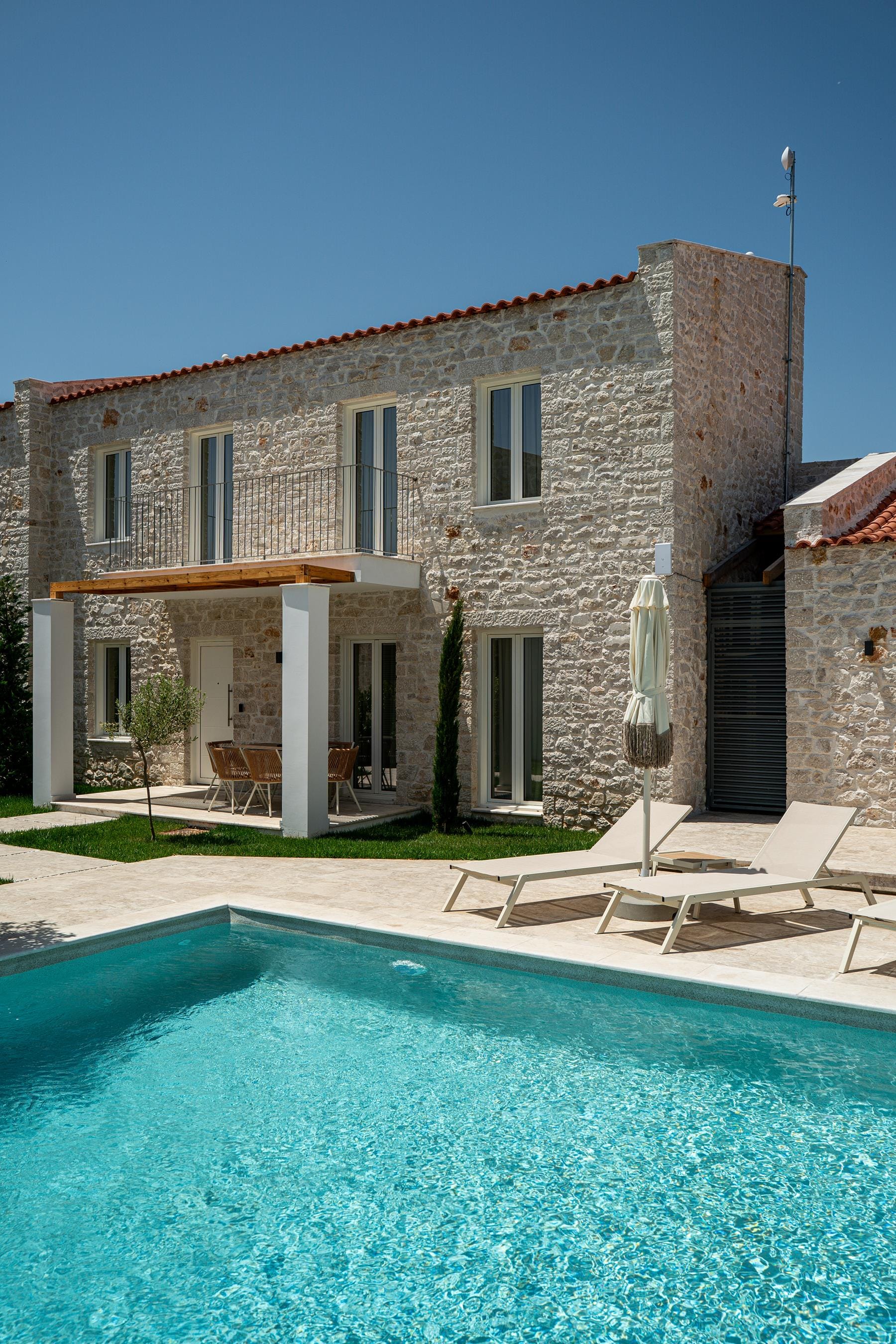 a swimming pool in front of a house
