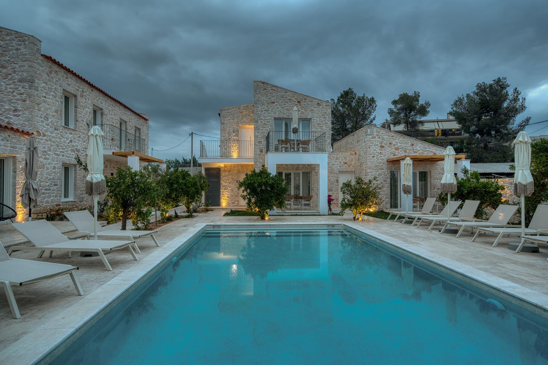 a pool with chairs around it