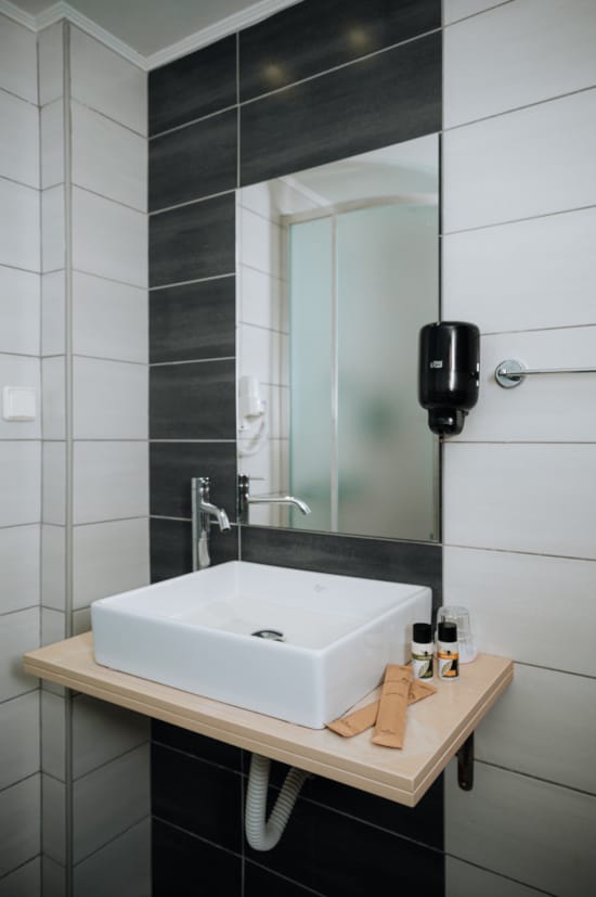 a bathroom with a mirror and sink