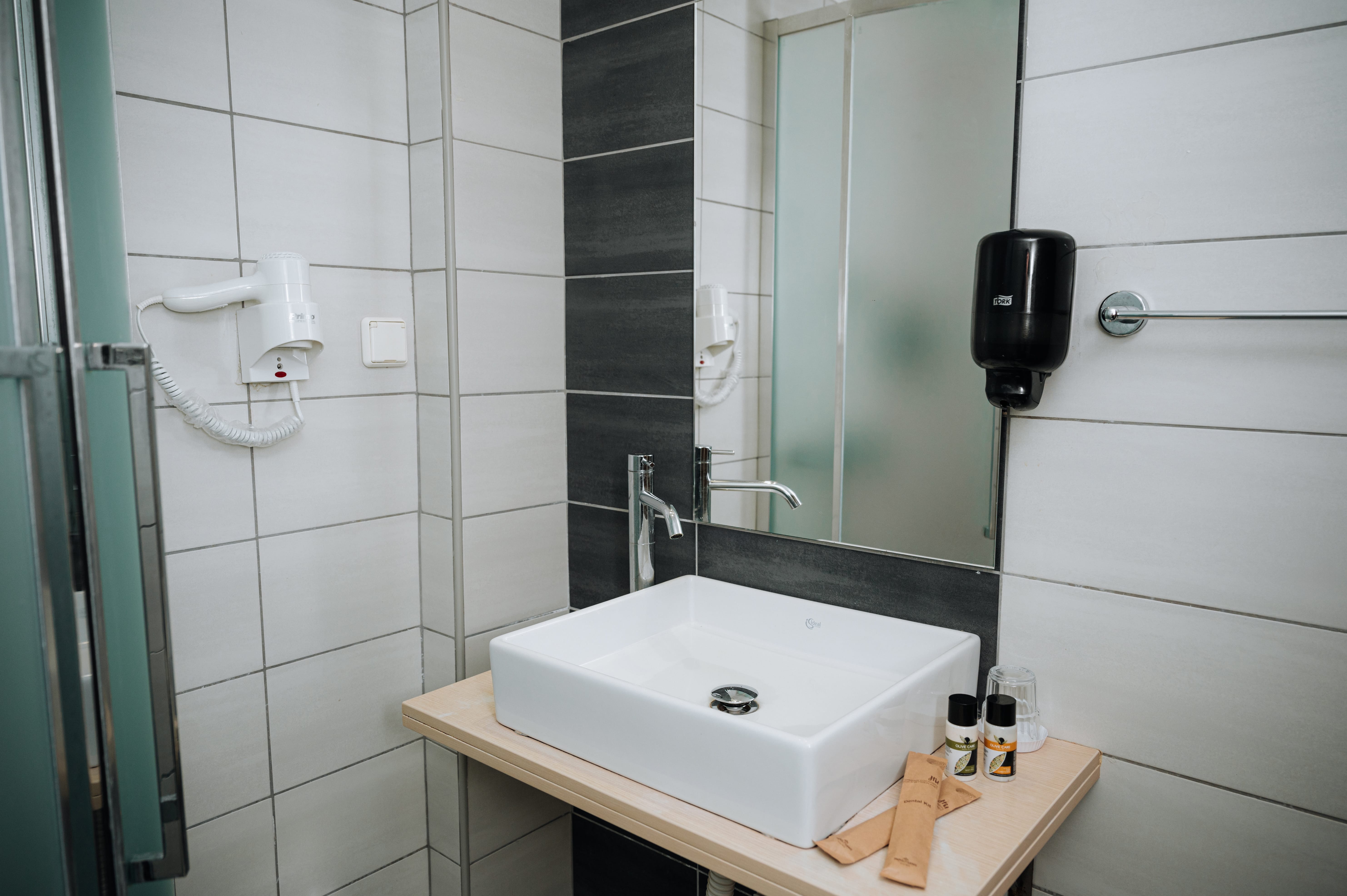 a bathroom with a sink and mirror