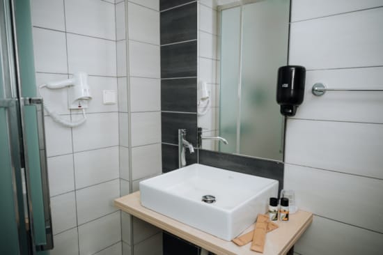 a bathroom with a sink and mirror