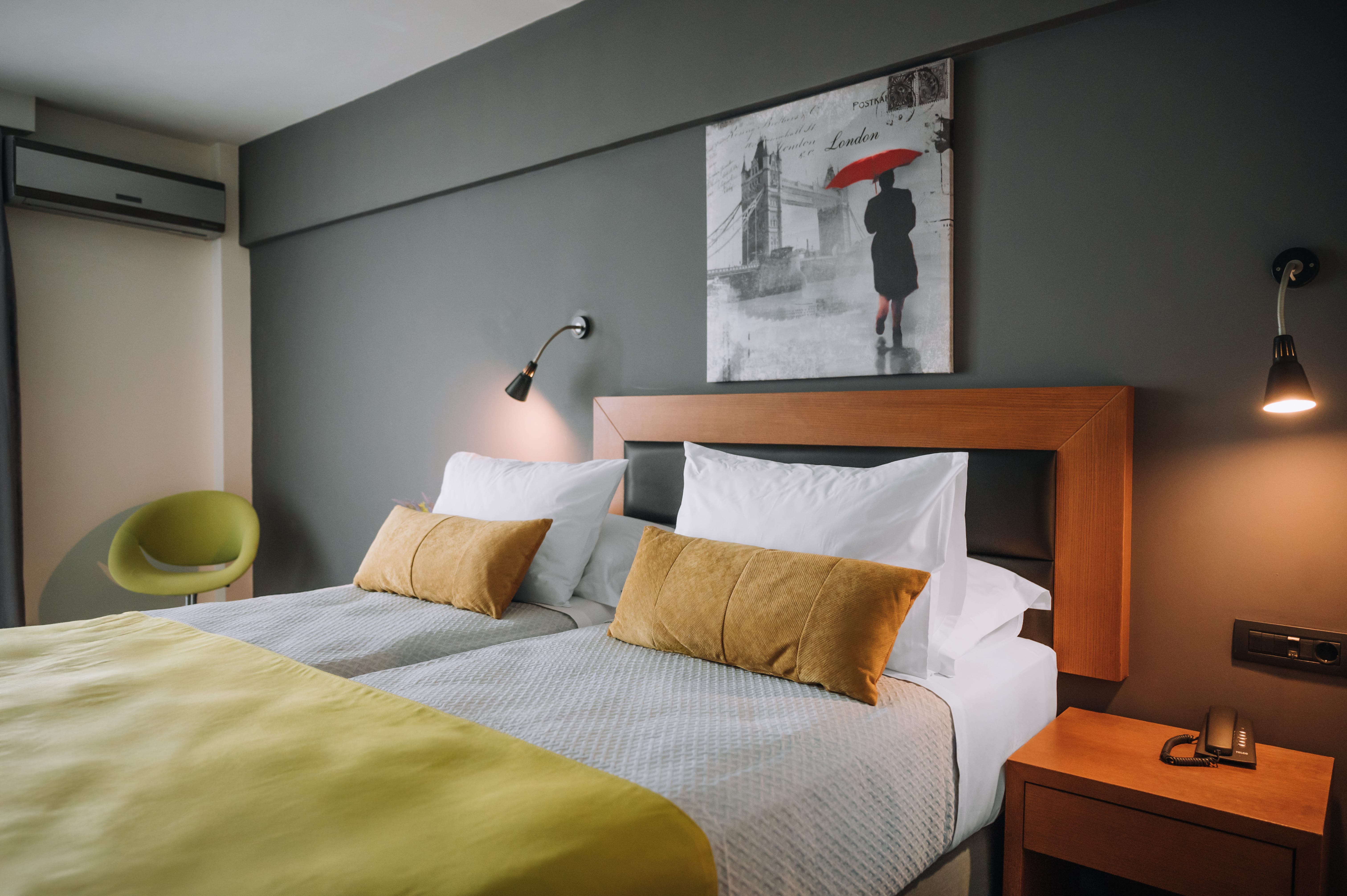 a bed with a yellow blanket