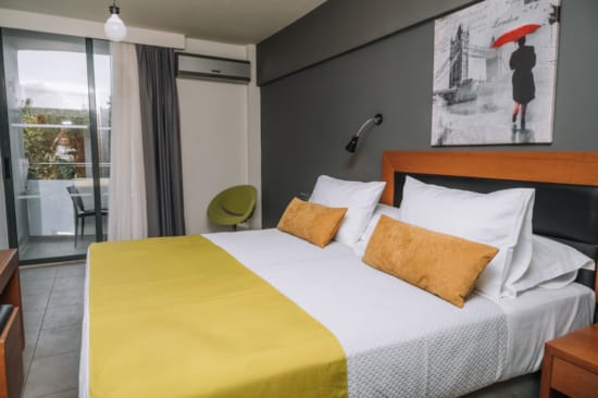 a hotel room with two beds