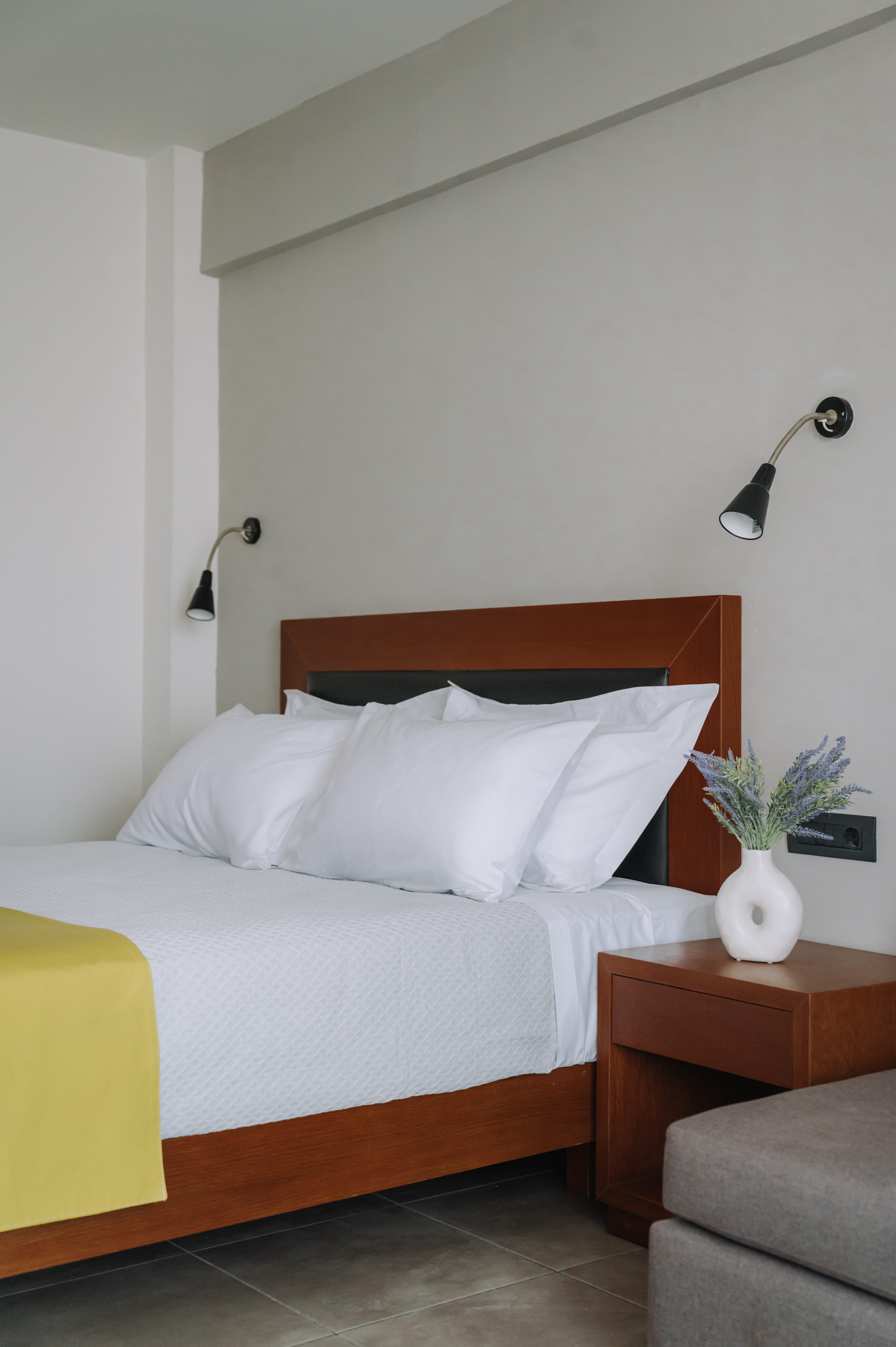 a bed with a white pillow