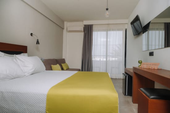 a bedroom with a bed and desk