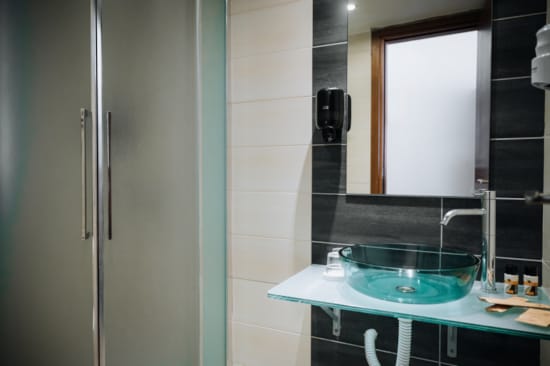 a bathroom with a sink and mirror