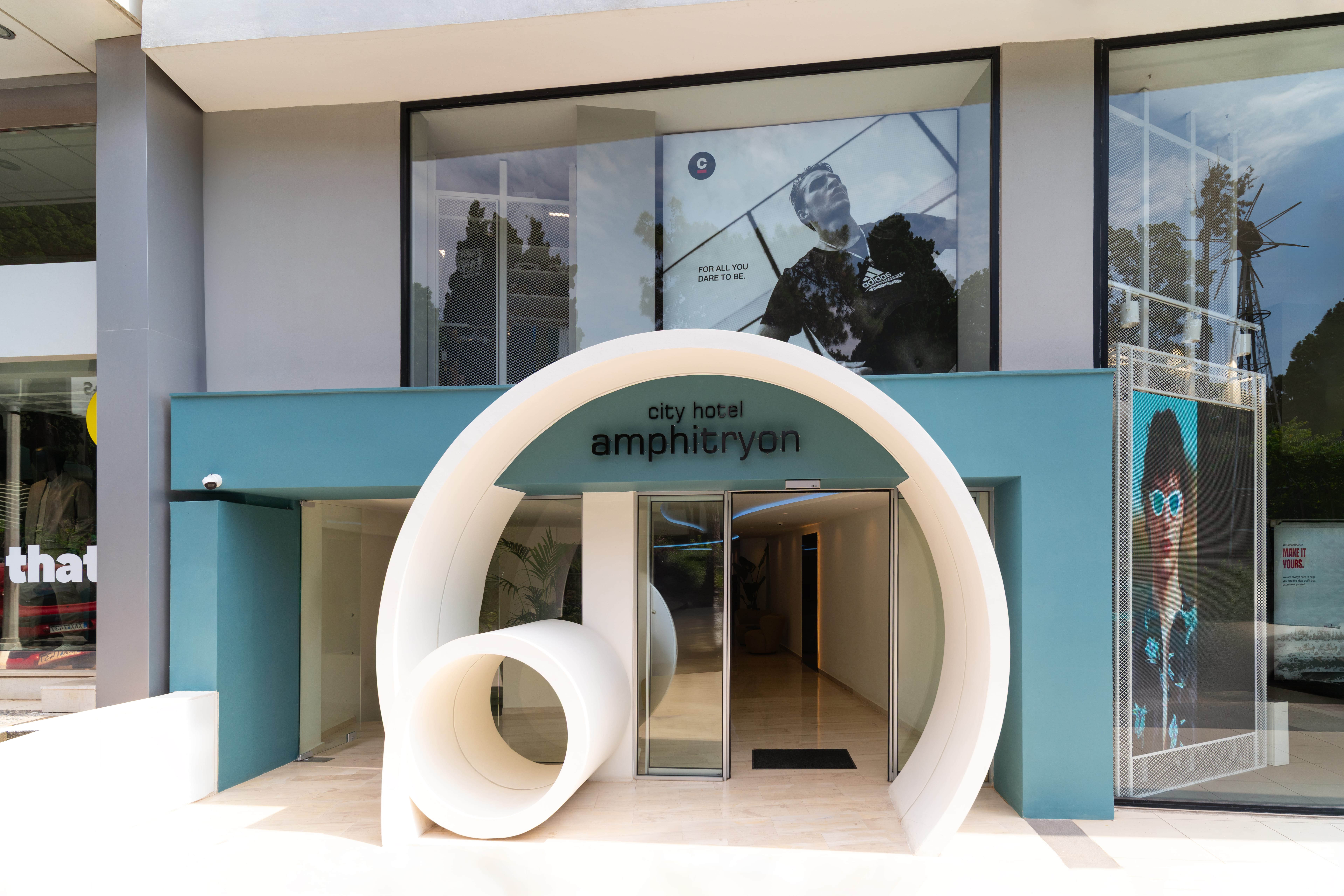 a large white sculpture in front of a building