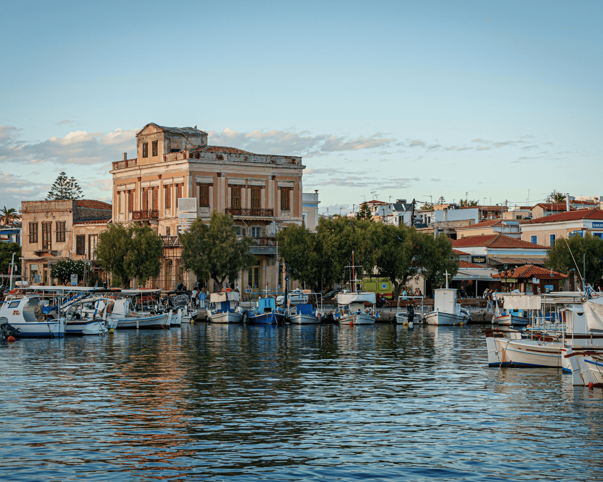 a body of water with boats in it and buildings around it