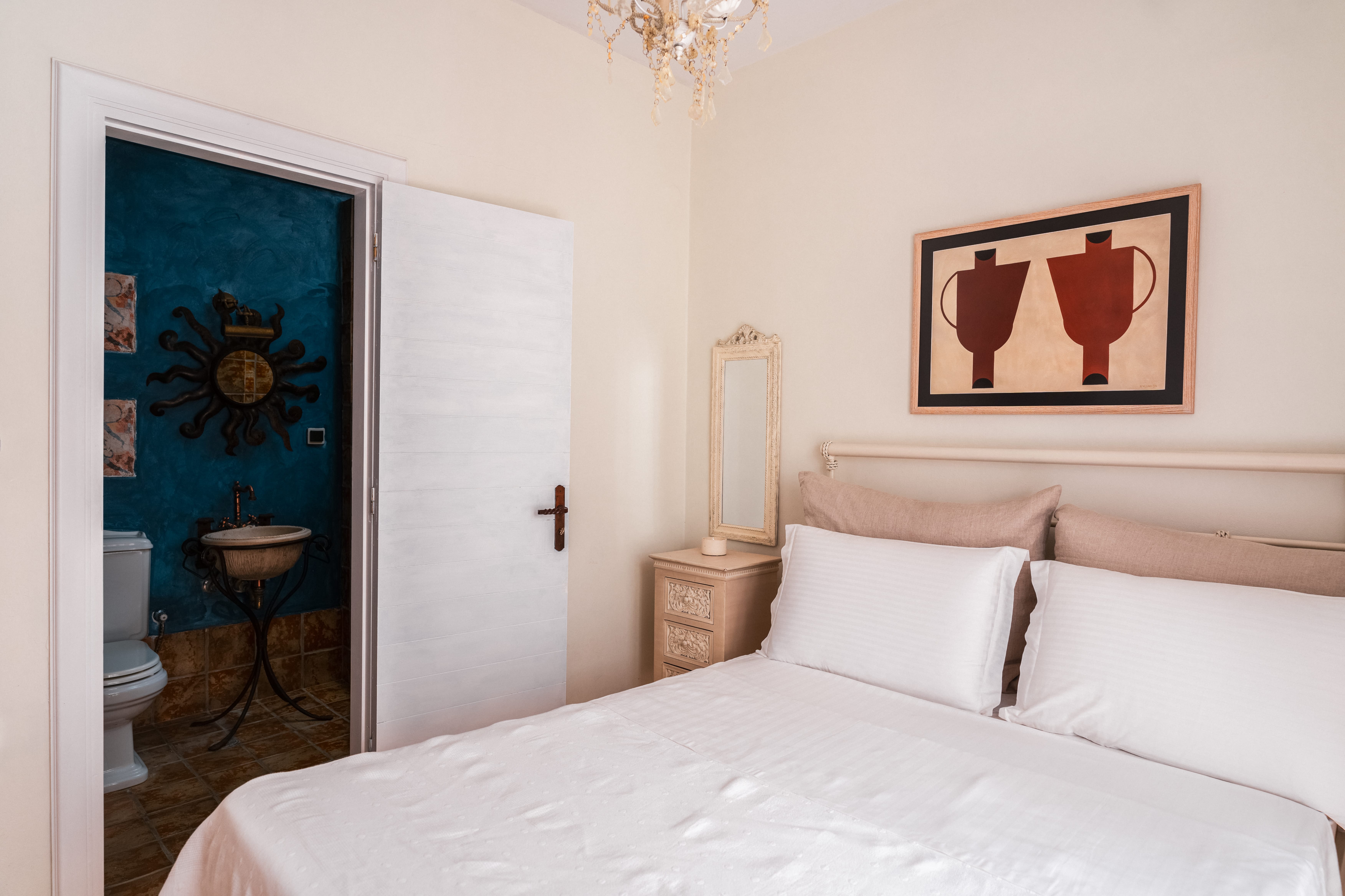 a bedroom with a bed and a door