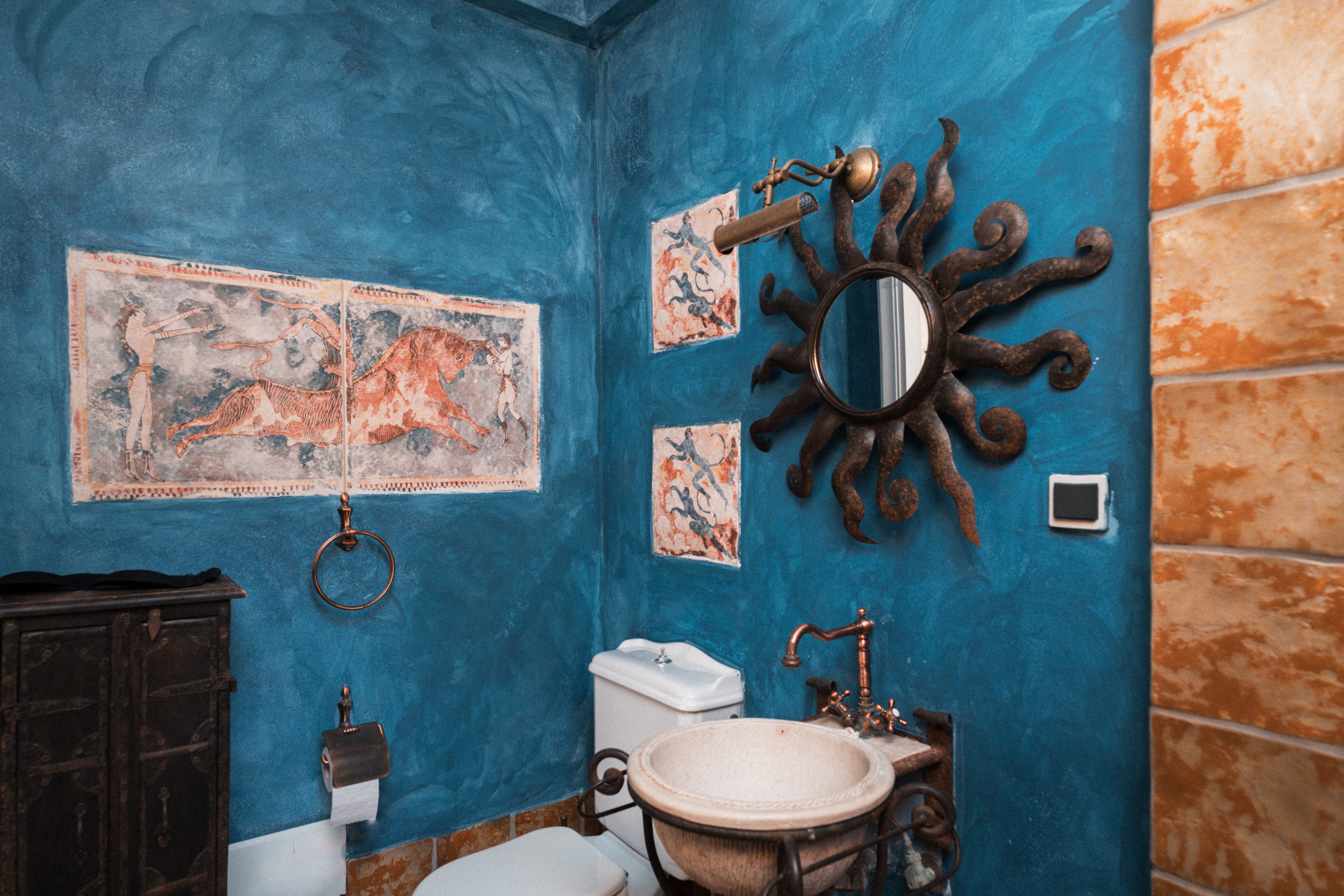 a bathroom with a blue wall