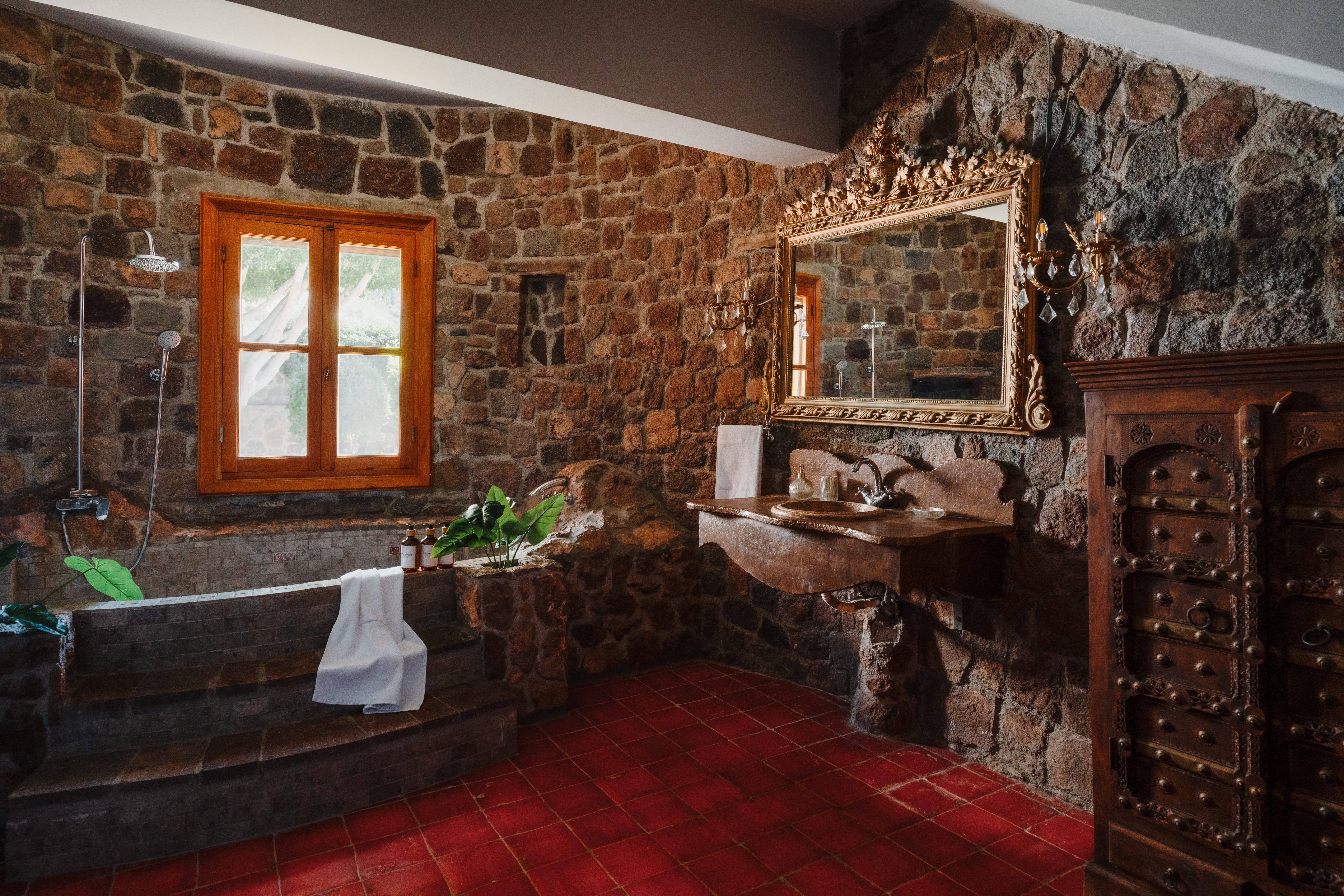 a room with a fireplace and a bench