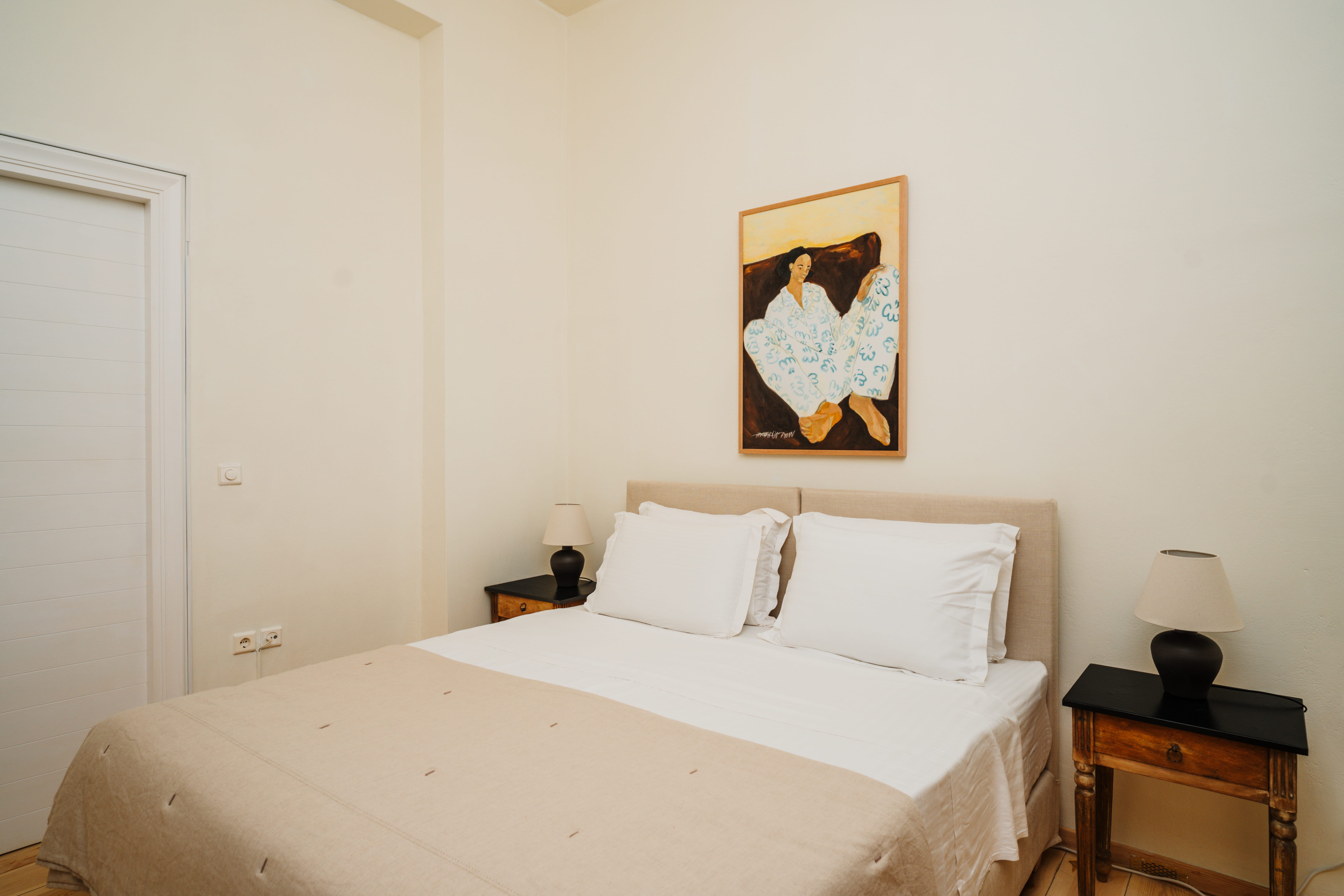 a bed with a white bed spread