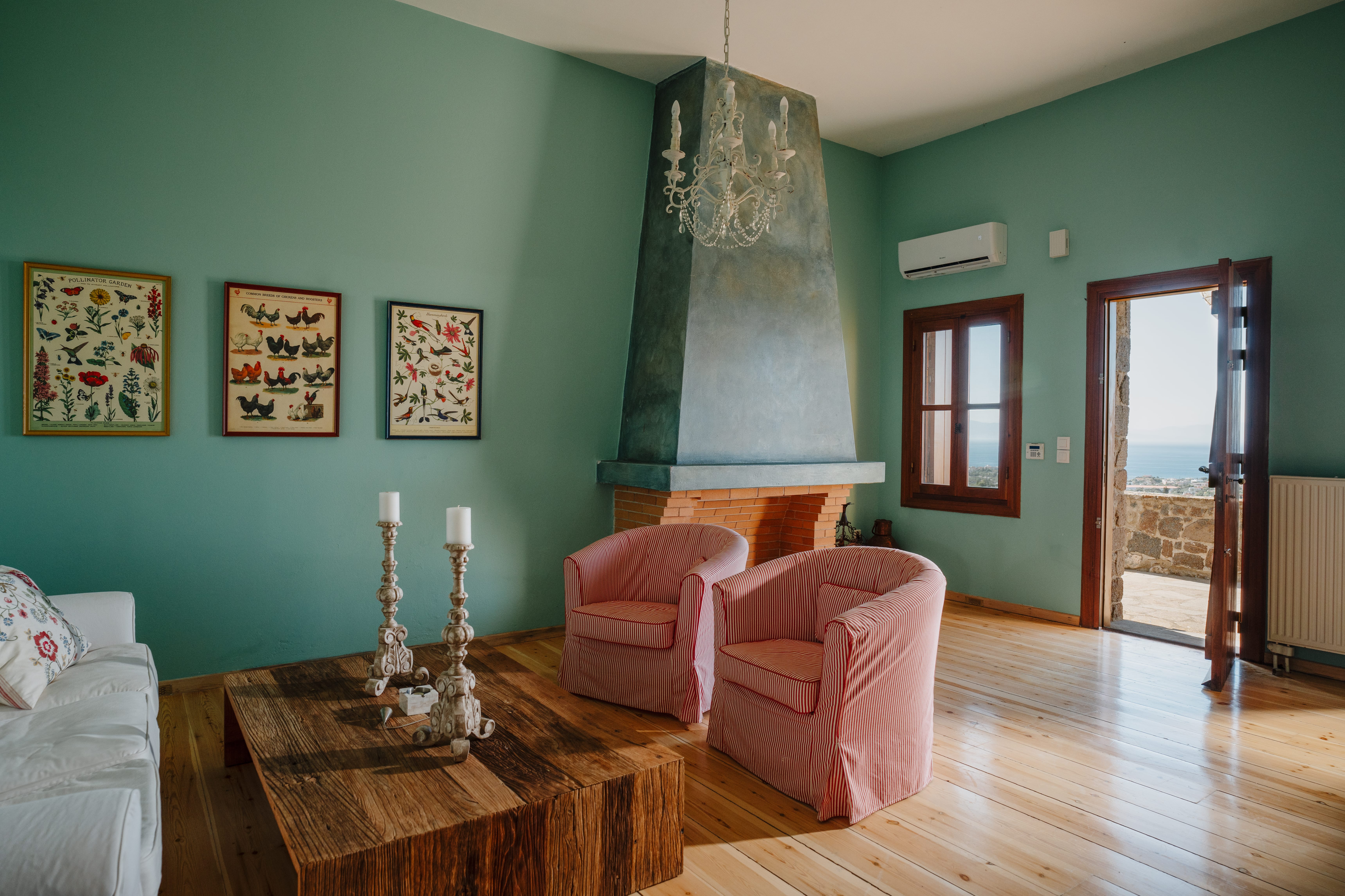 a living room with green walls