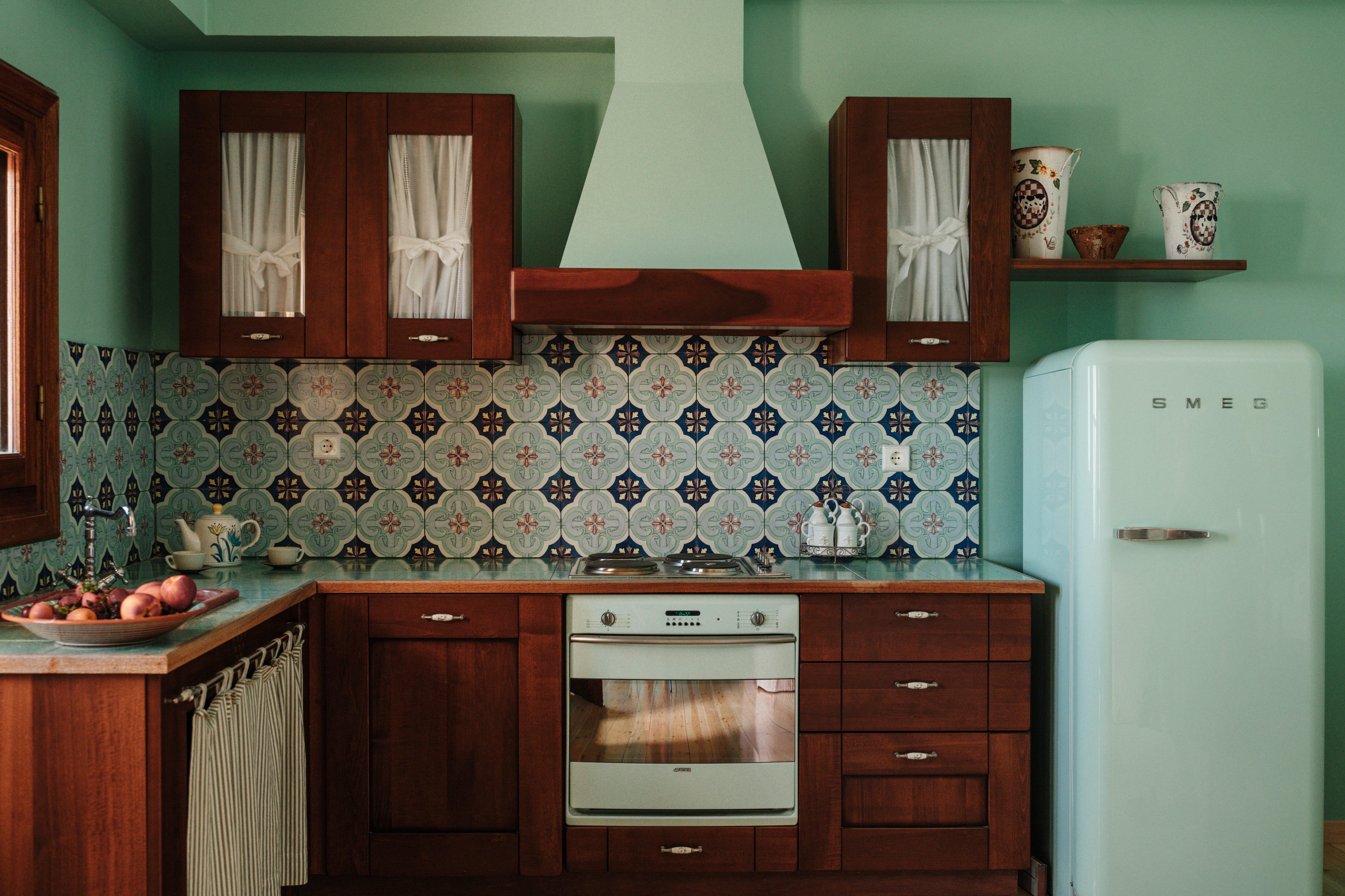 a kitchen with wooden cabinets