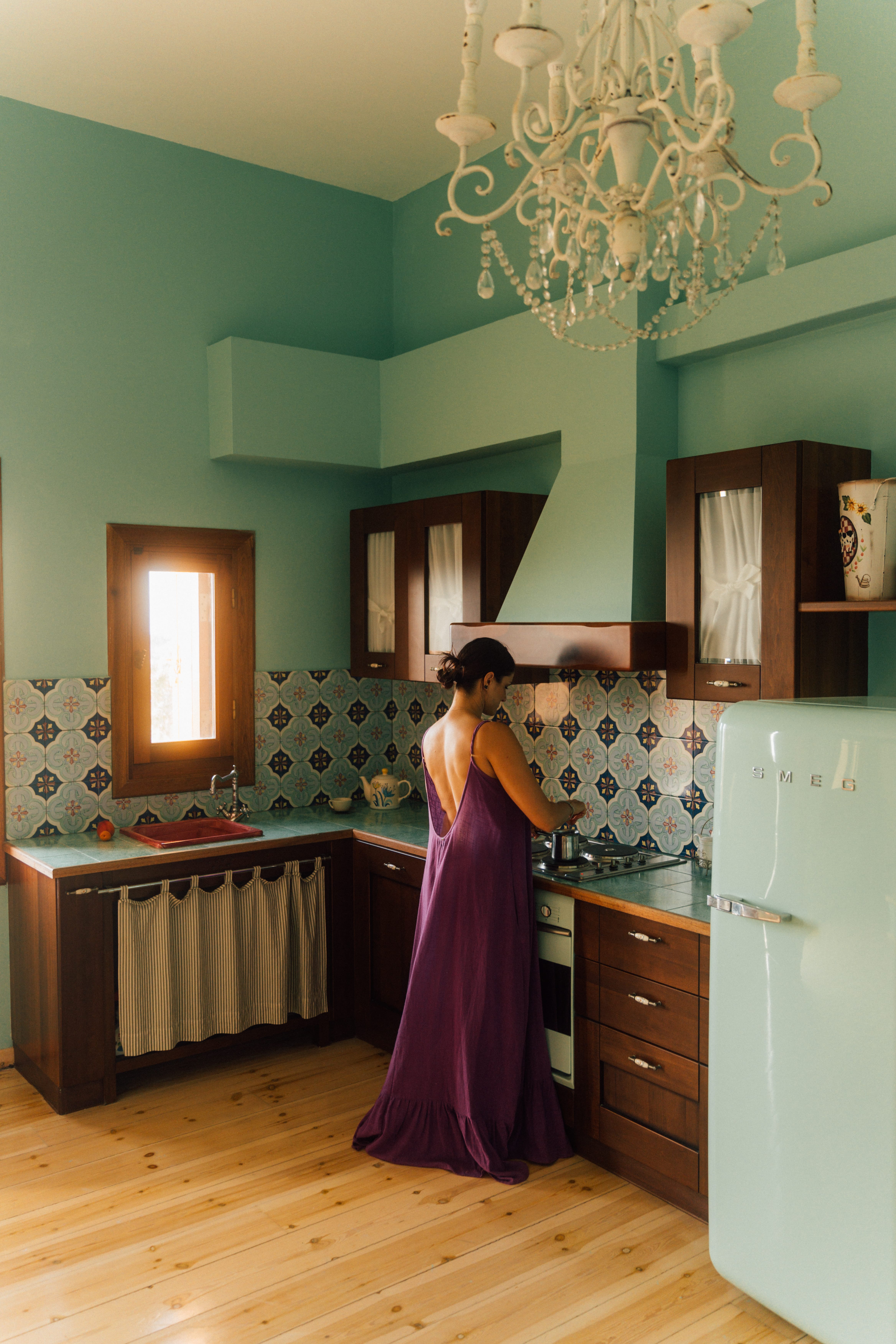 a person in a dress in a kitchen