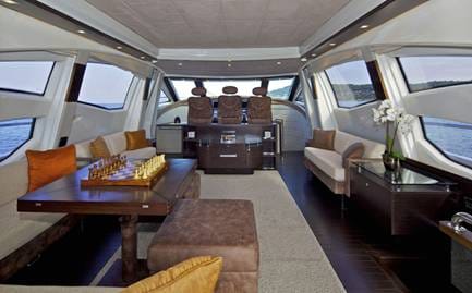 inside of a vehicle with chairs and tables